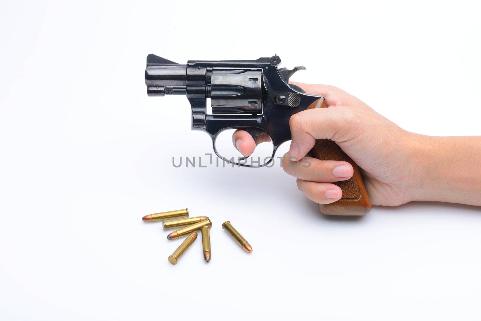 Woman's Hand hold revolver gun beside bullet .22  Isolated On White Background