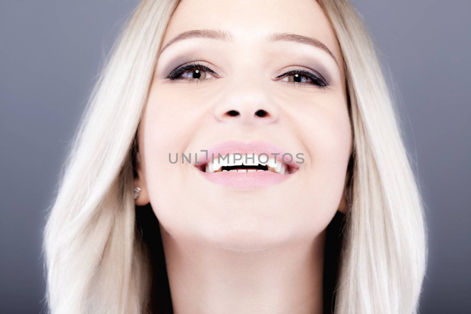 portrait of attractive caucasian girl with shiny blond hair . main focus on lips