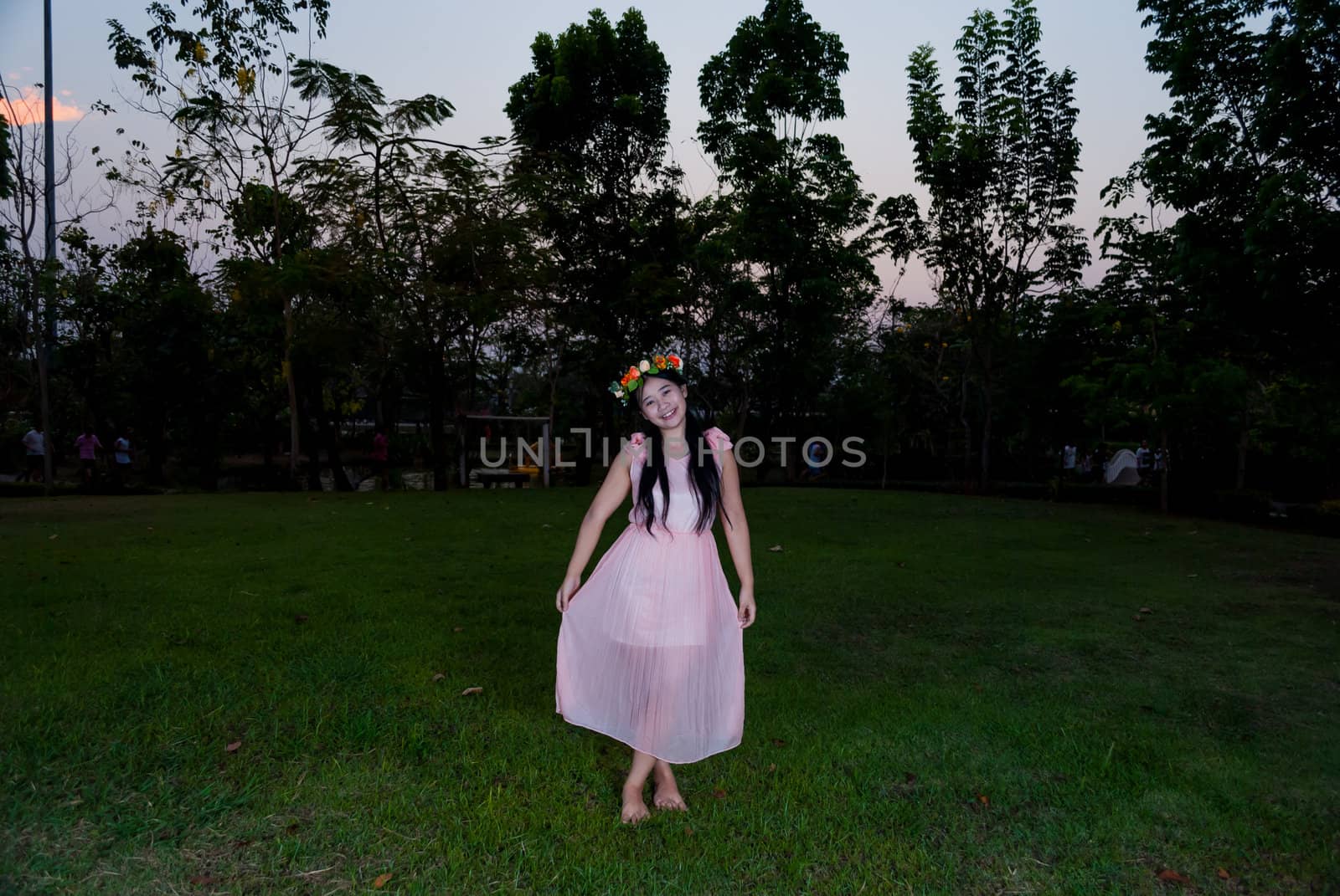 Asian Thai Girl with Flower Crown in the Park