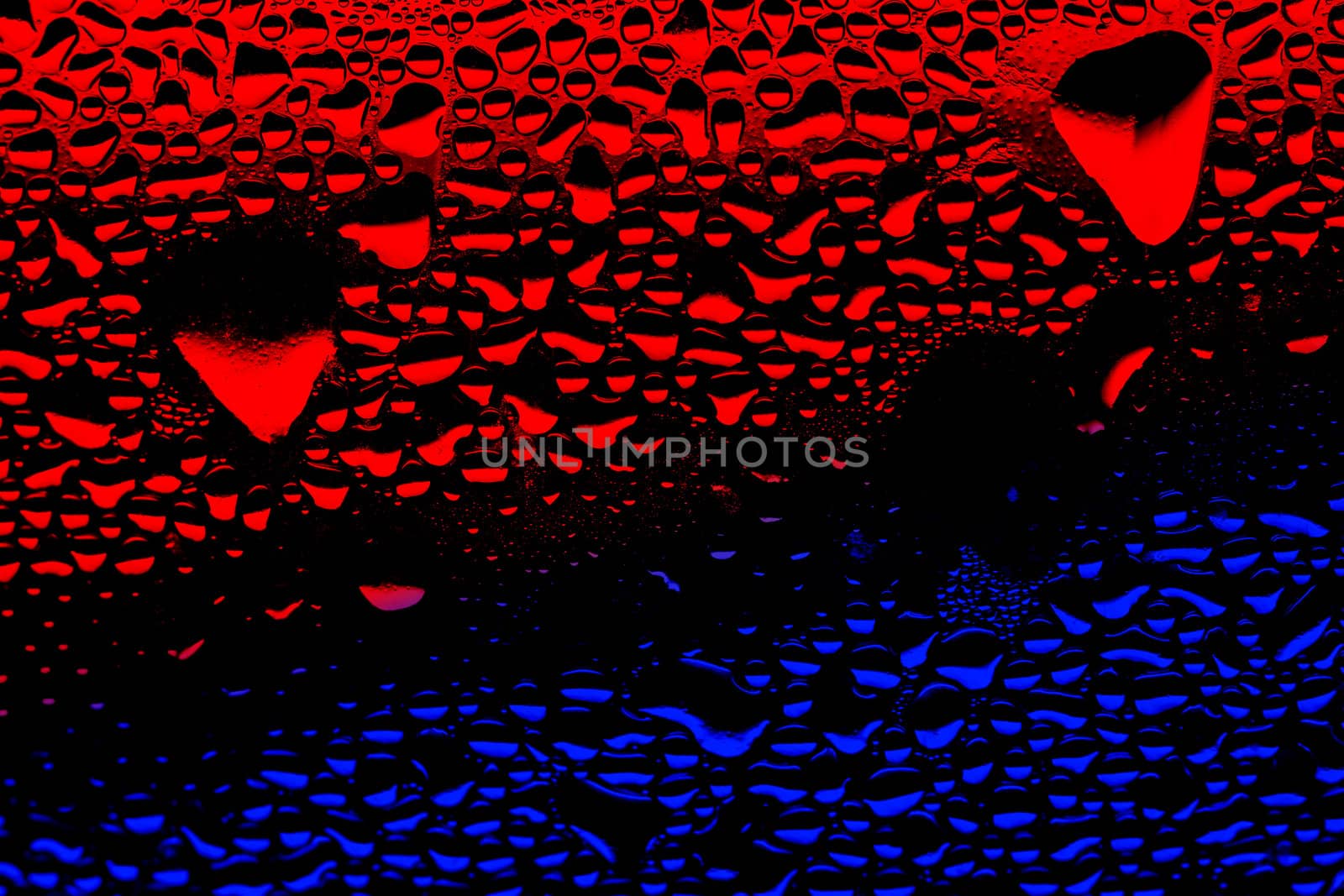 condensation red and blue water drops on a plastic surface