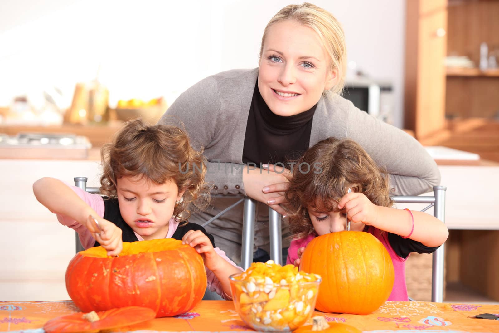 Mother and child preparing pumpkin