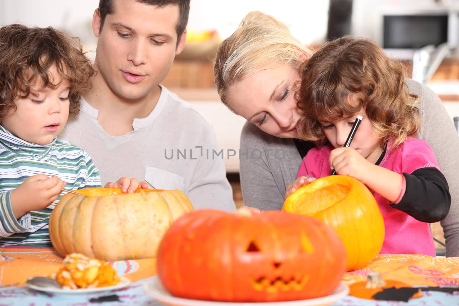 Family sculpting pumpkins by phovoir