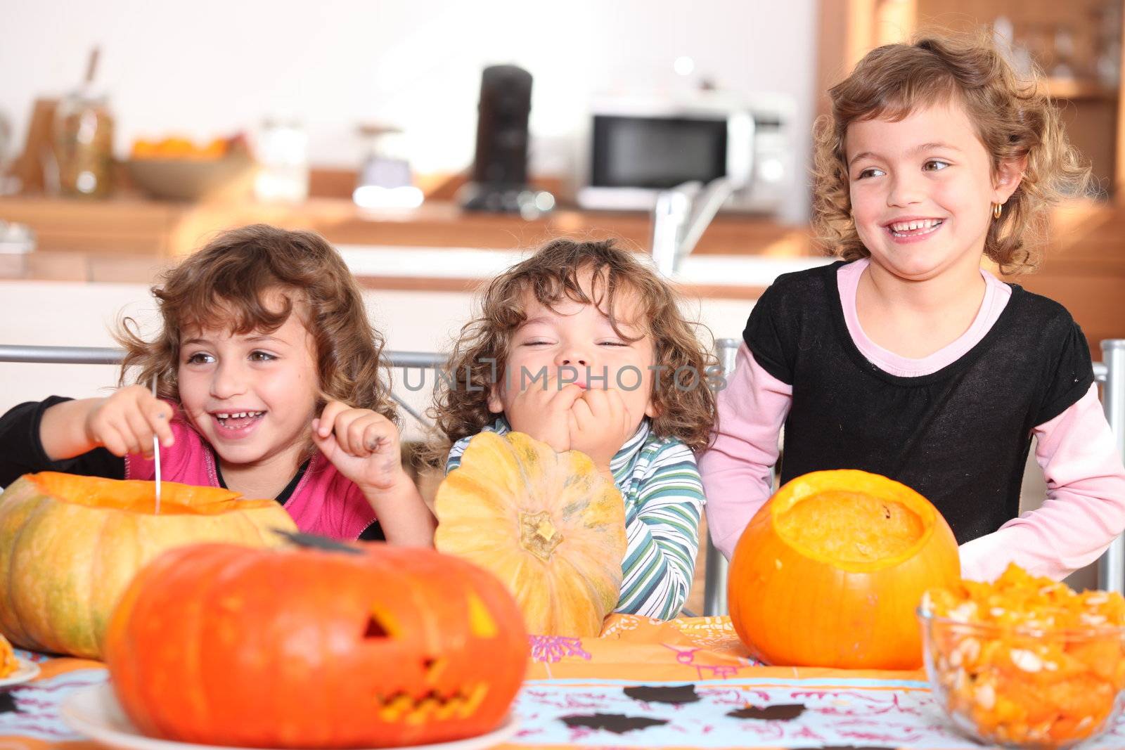 Funny Kids carving pumpkins by phovoir