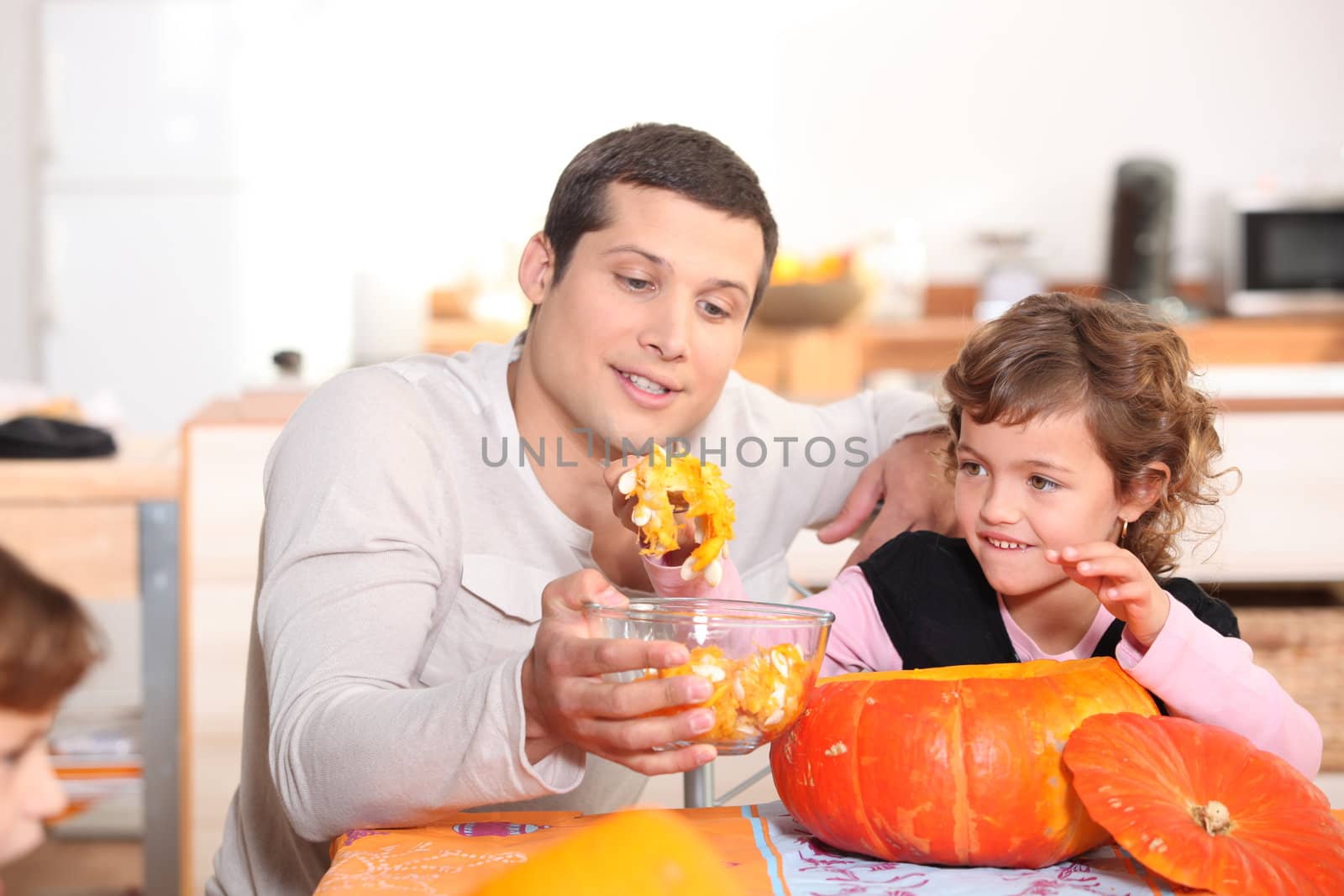 a father and his daughter at Halloween time by phovoir