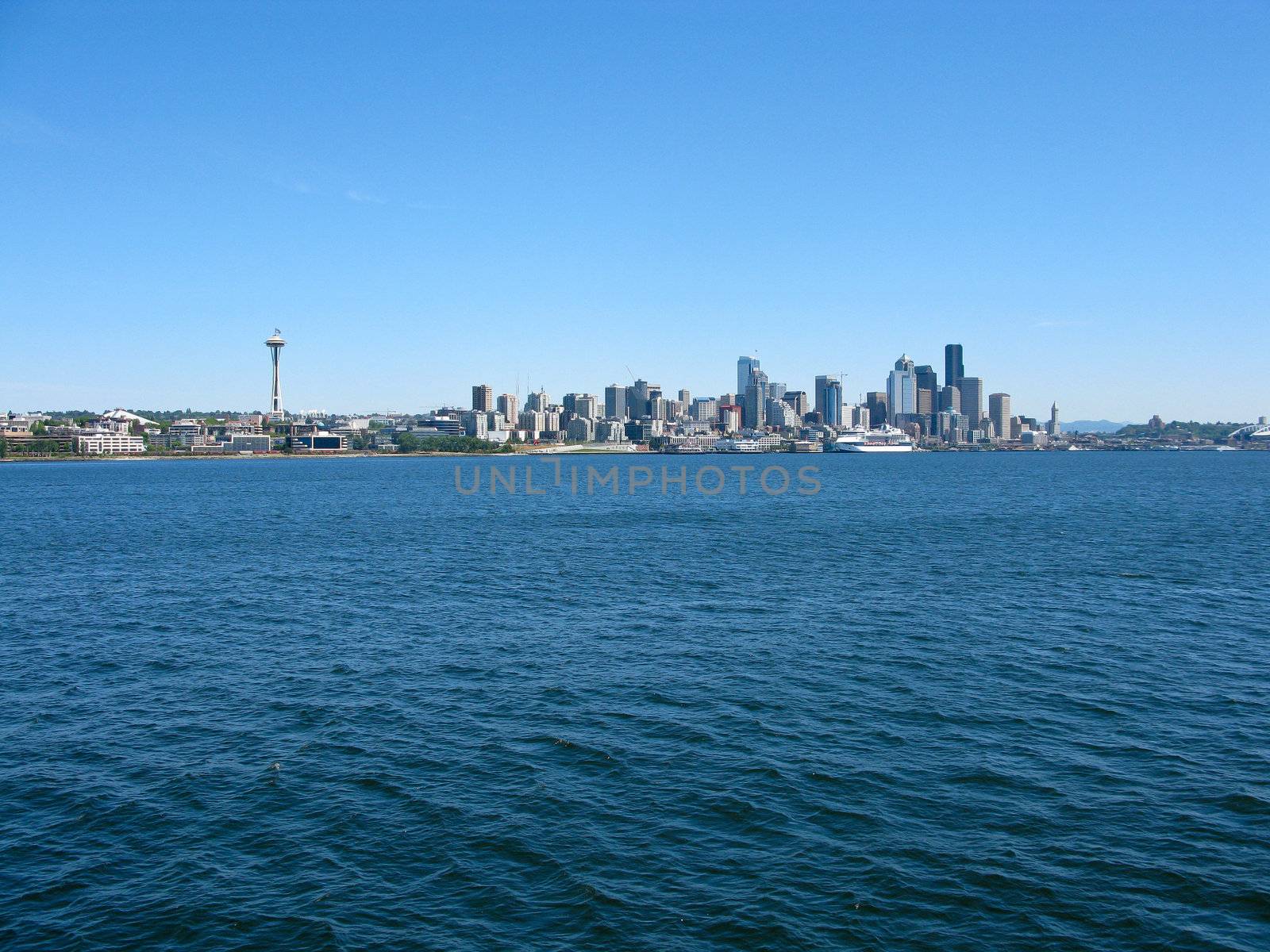 view of the seattle skyline with water, space needle, skyscrapers, pacific northwest