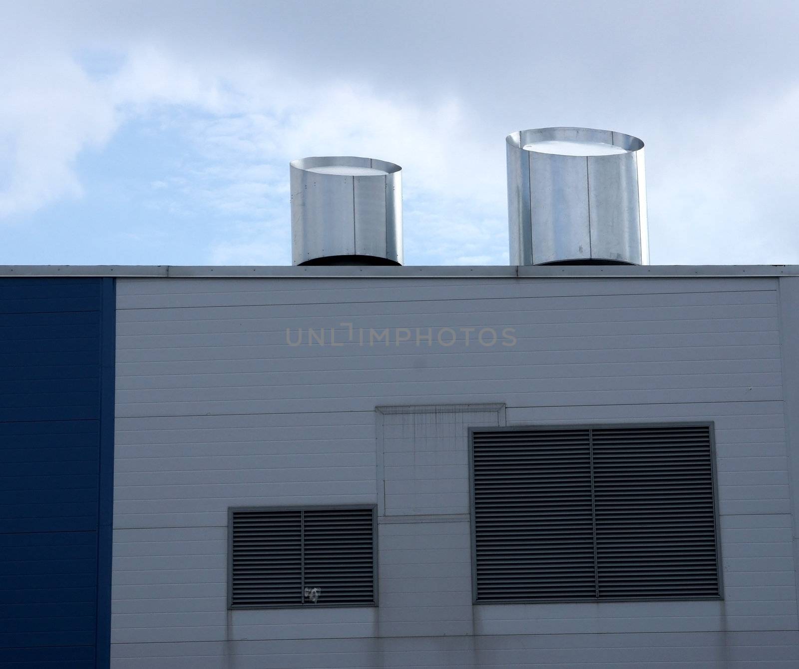 Ventilation on a roof and a wall of an industrial building