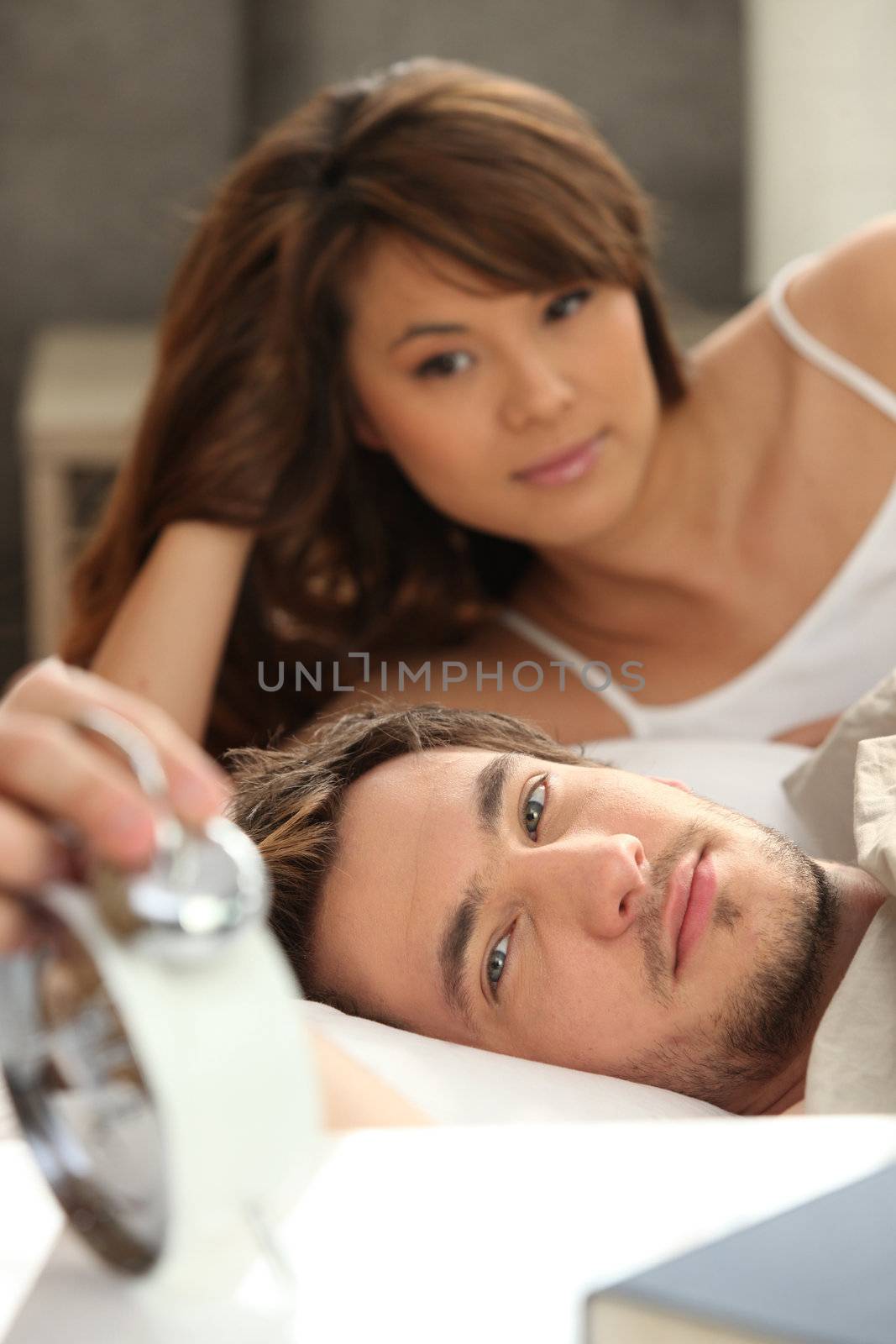 Couple slowly waking up by phovoir