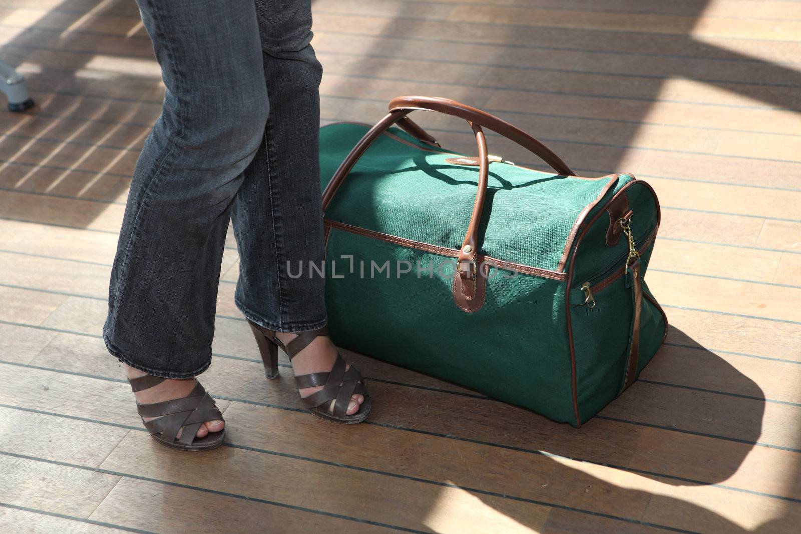 Woman stood next to baggage