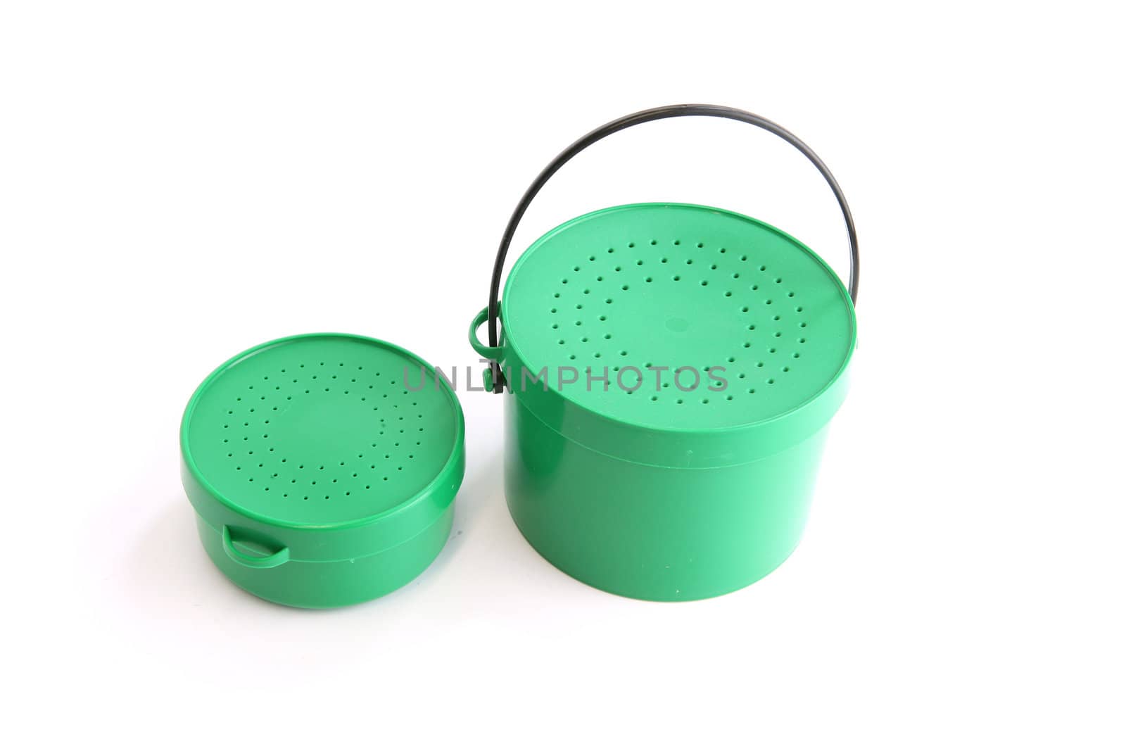 Two green tins with perforated lids