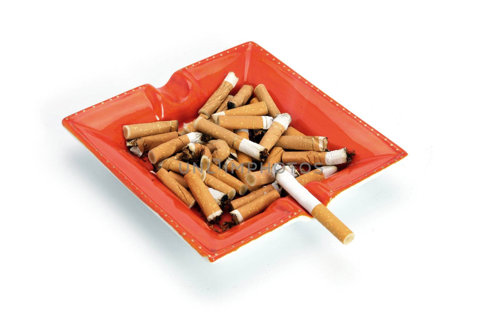 Cigarettes in an ashtray by phovoir