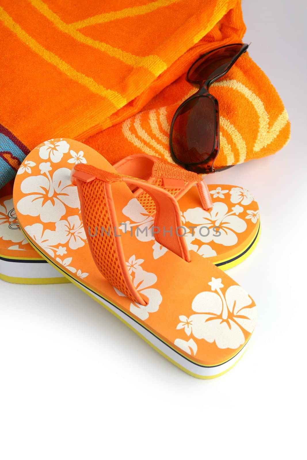 Flip-flops, sunglasses and towel