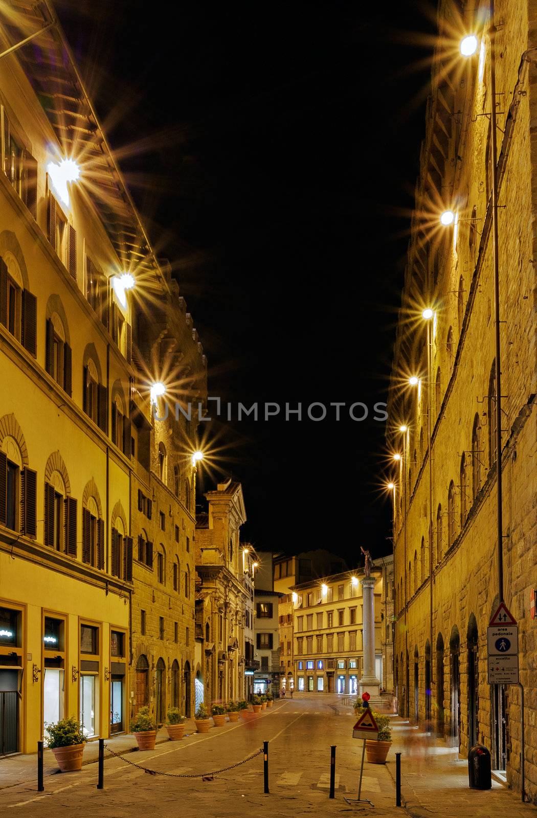 A empty street at night in Florence Italy