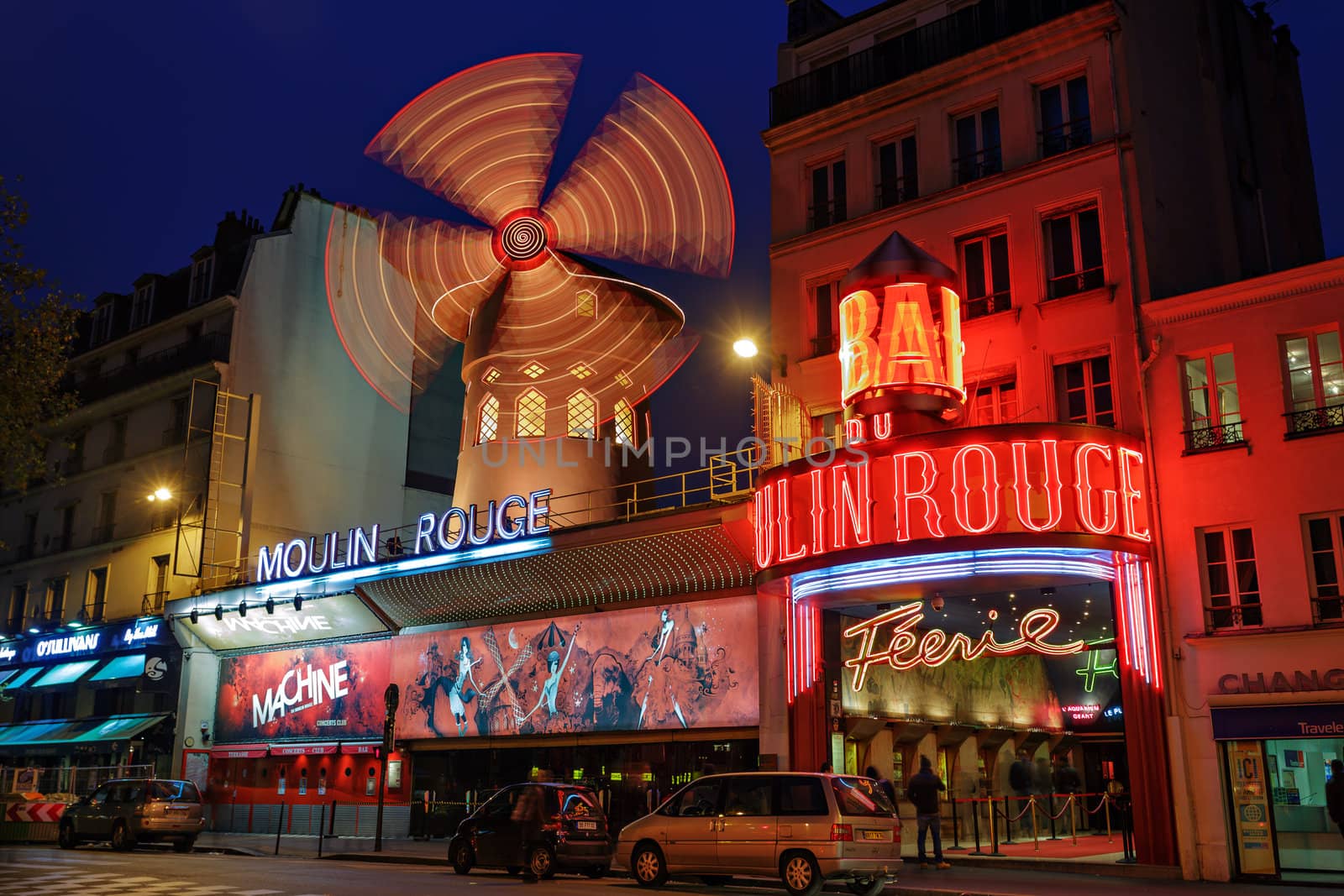PARIS - NOV 12: The Moulin Rouge by night, on November 12, 2012 in Paris, France. Moulin Rouge is a famous cabaret built in 1889, locating in the Paris red-light district of Pigalle