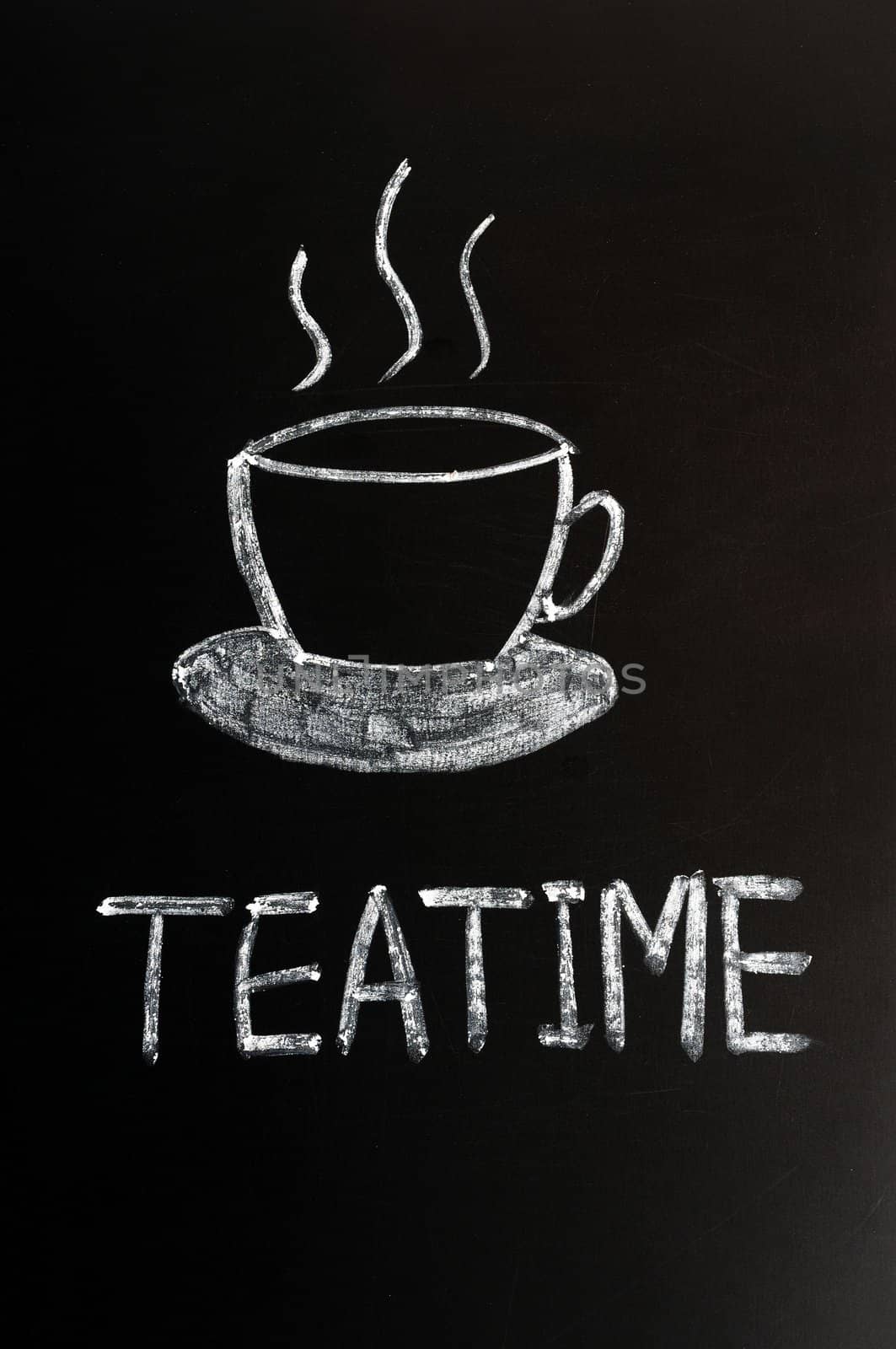 Chalk drawing of teatime with a cup on a blackboard