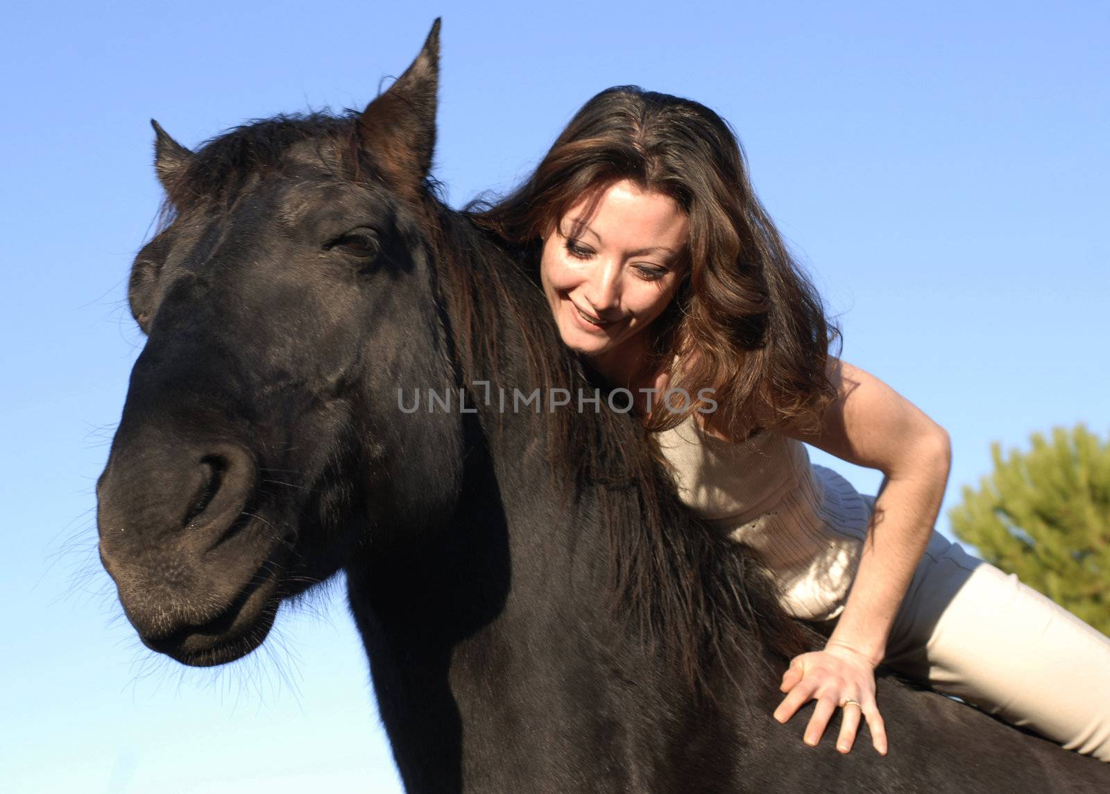 young woman and her best friend black stallion