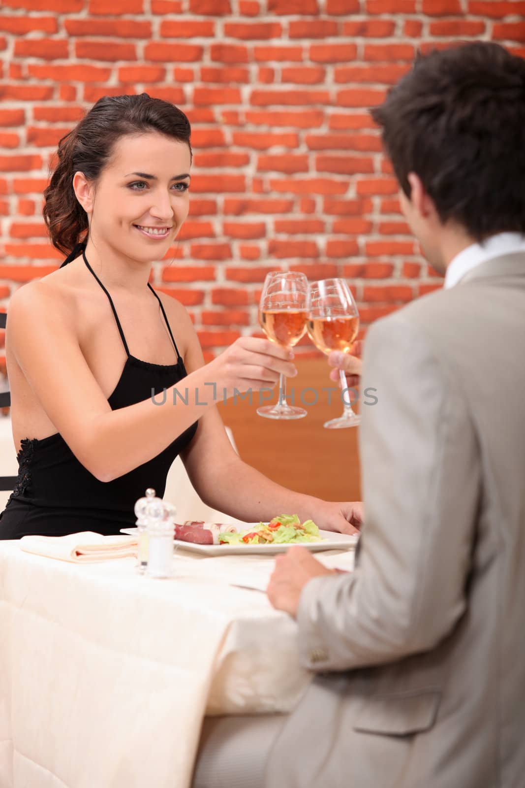 Couple in a restaurant by phovoir