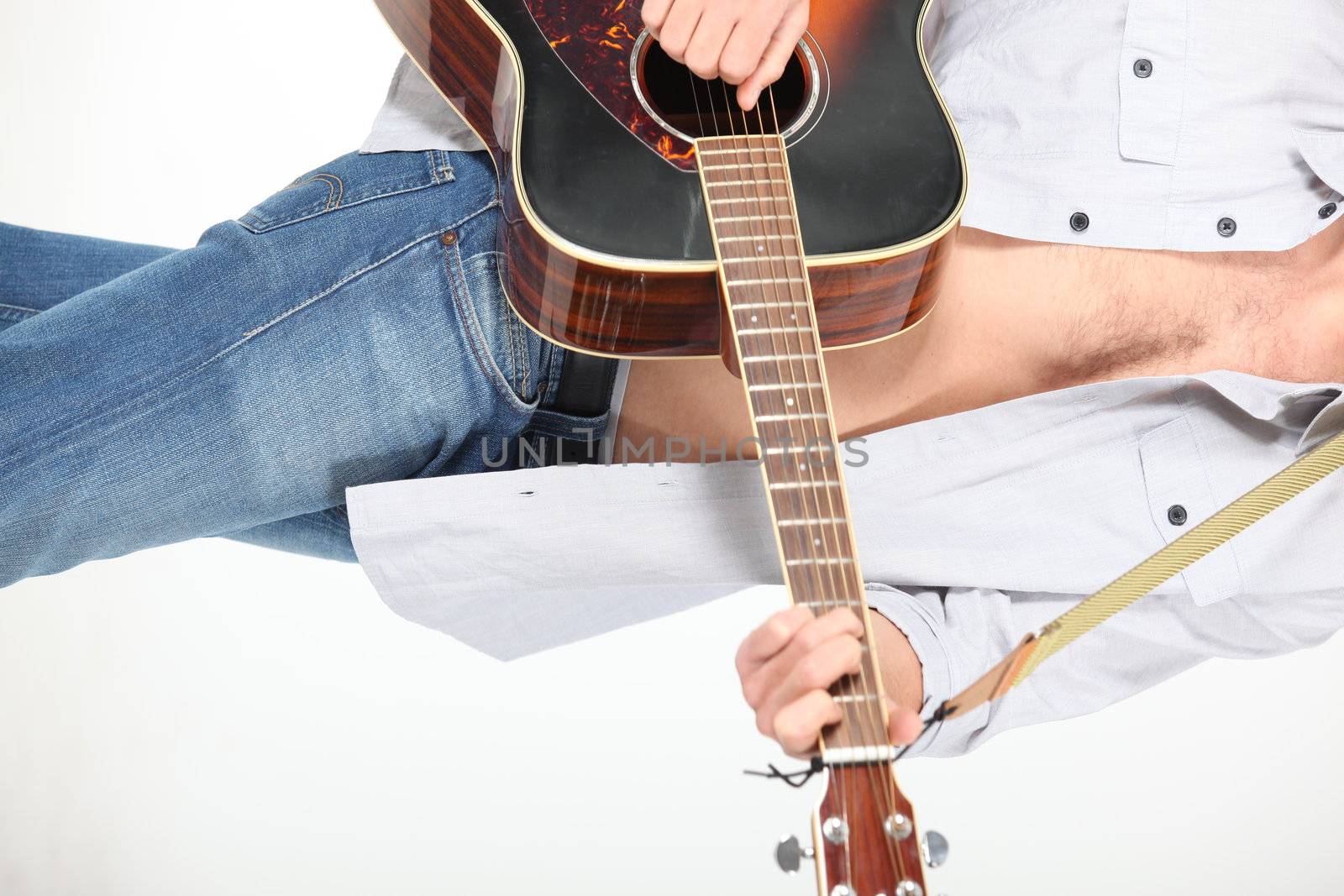 young man playing guitar