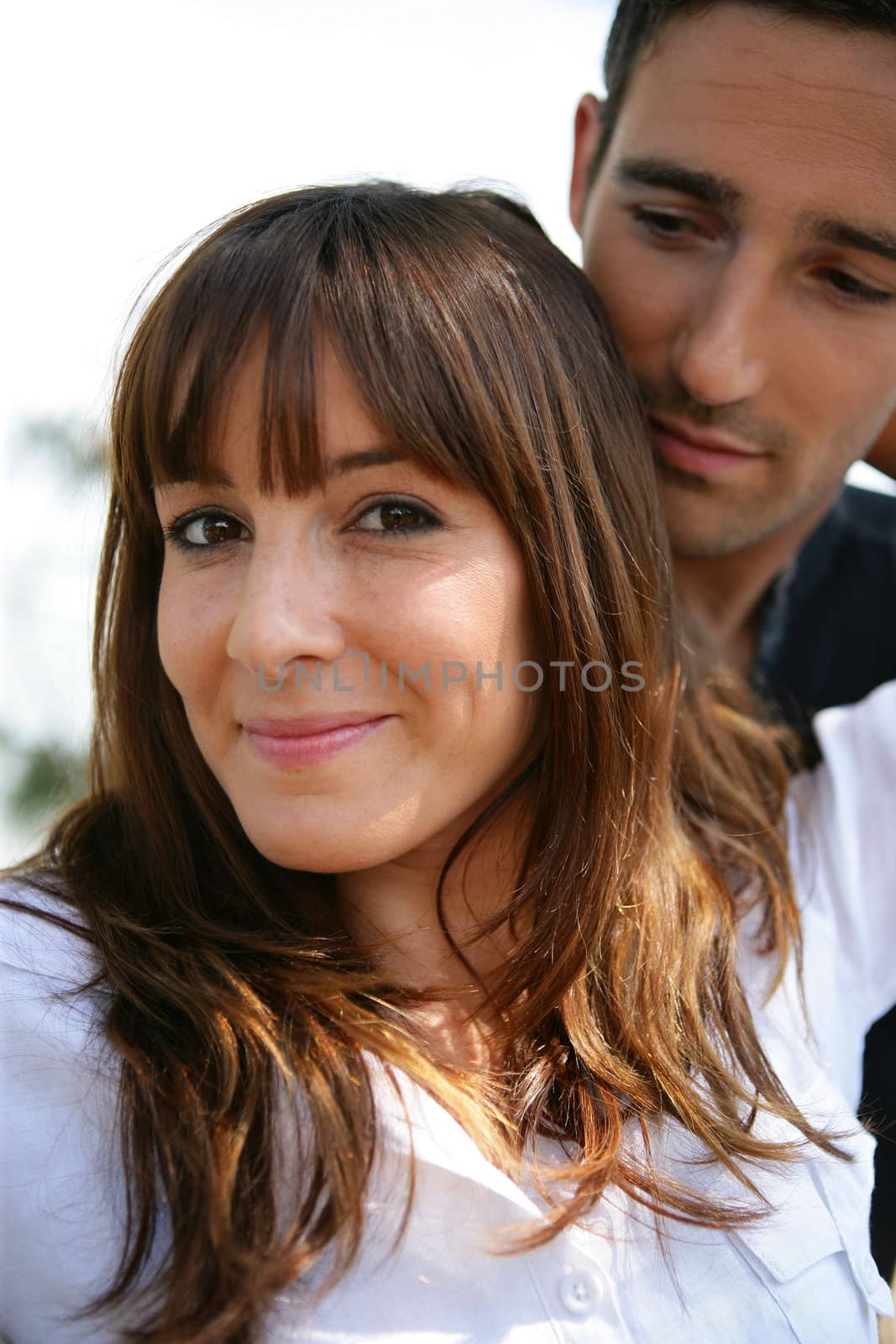 Affectionate couple hugging outdoors