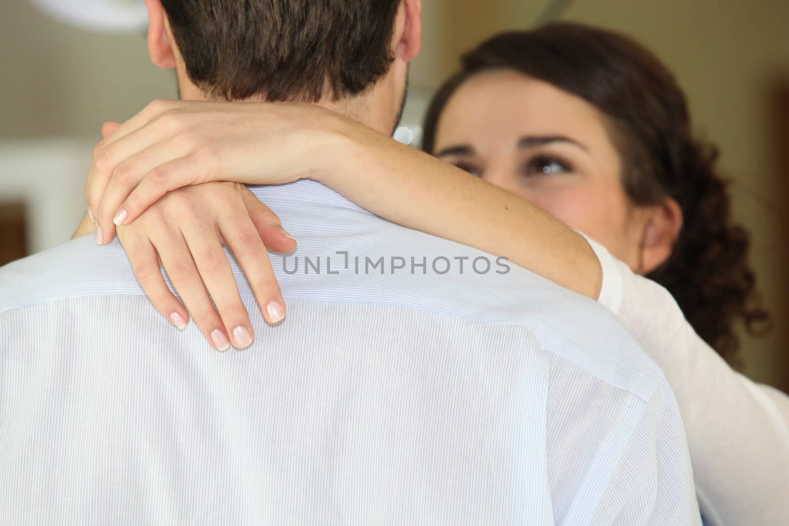 Young couple hugging by phovoir