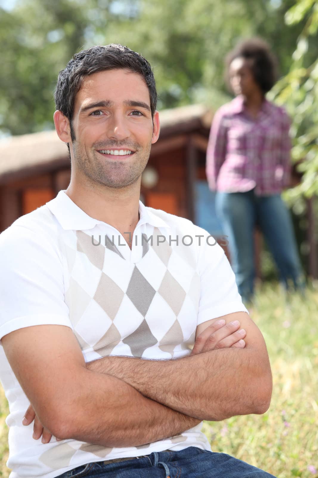 Couple in front of chalet by phovoir