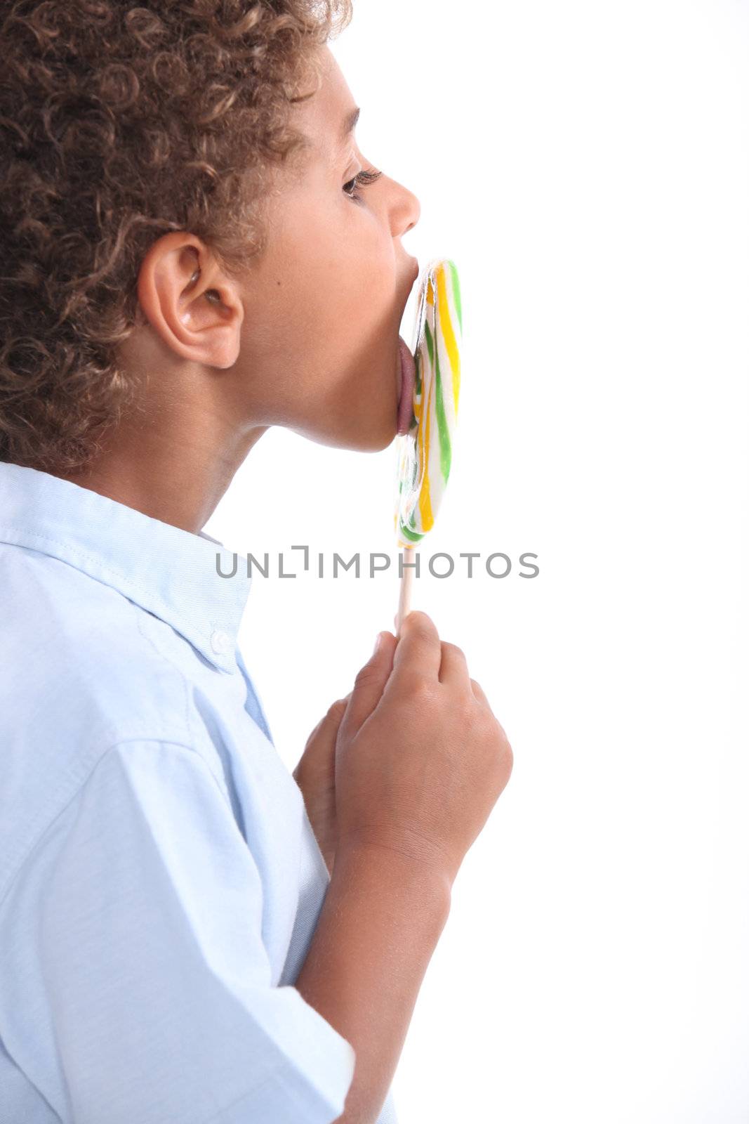 child licking lollipop by phovoir