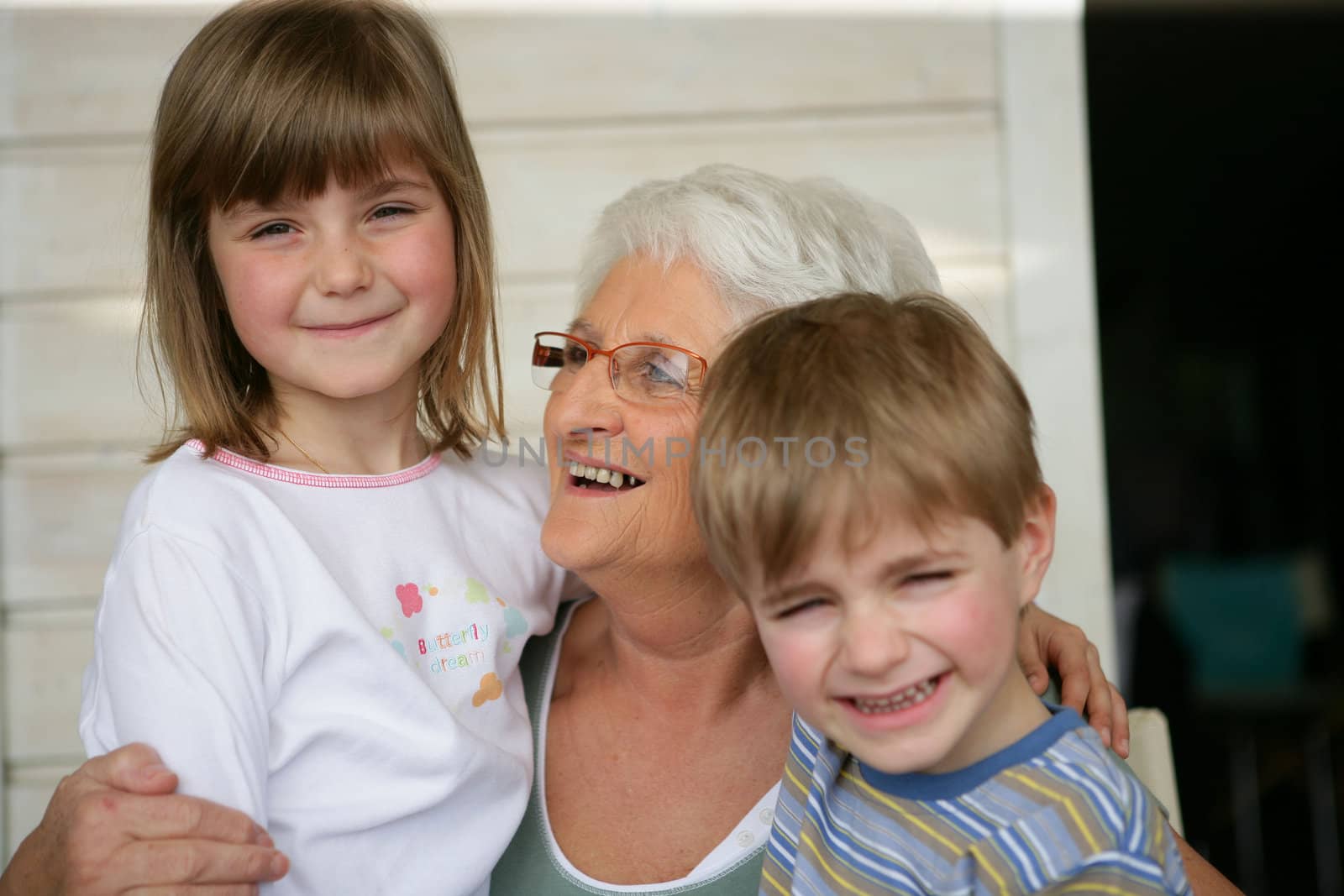 Grandmother looking after grandchildren by phovoir