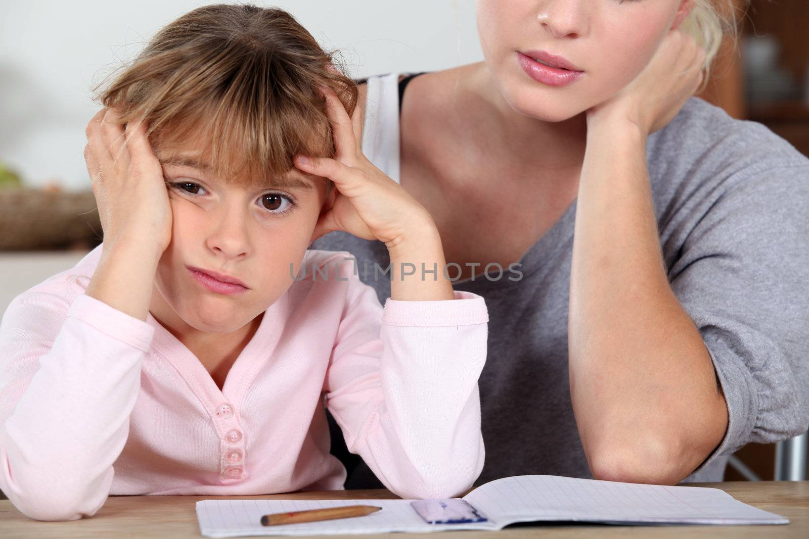 Little girl bored of her homework