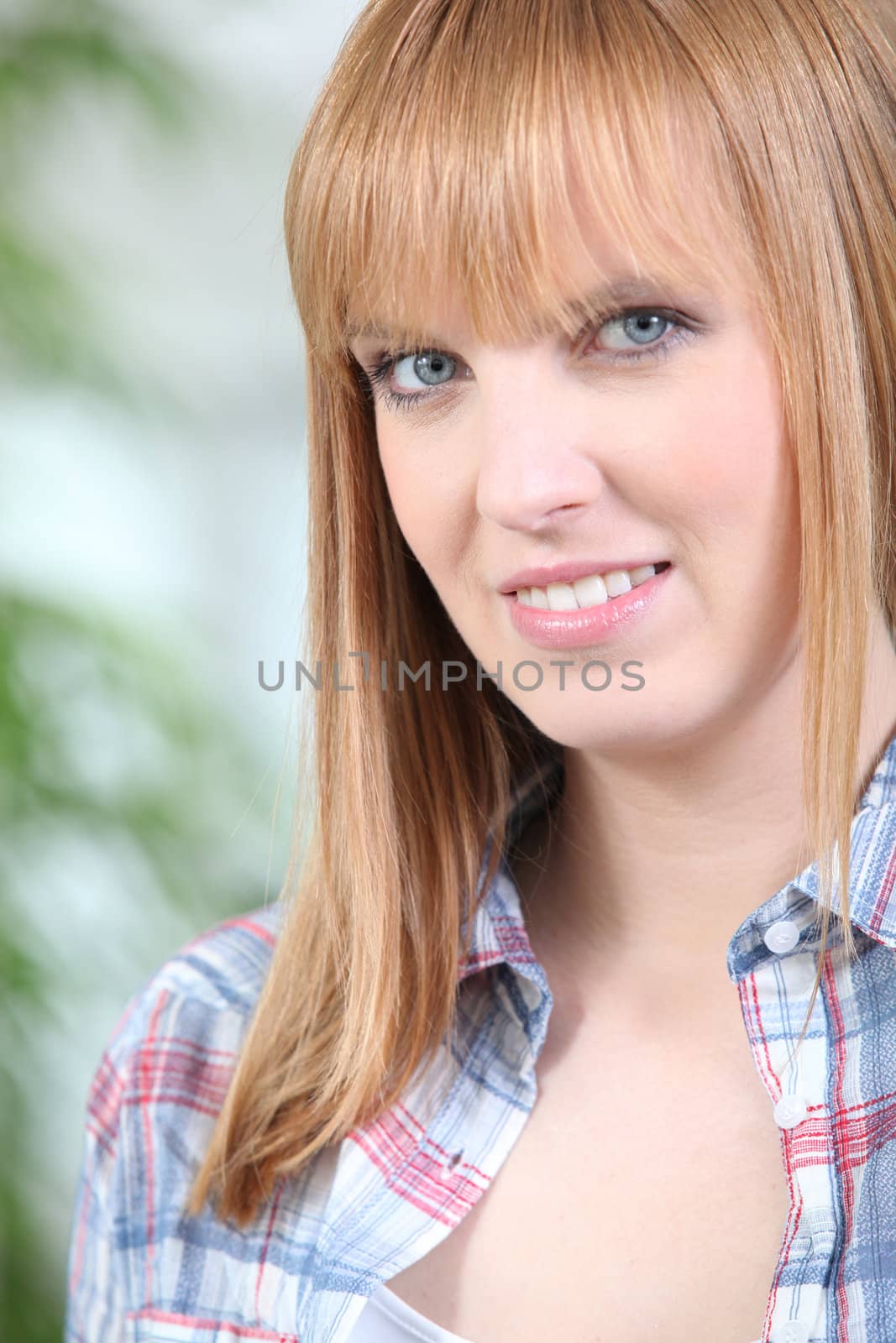 Portrait of a woman in a checked shirt