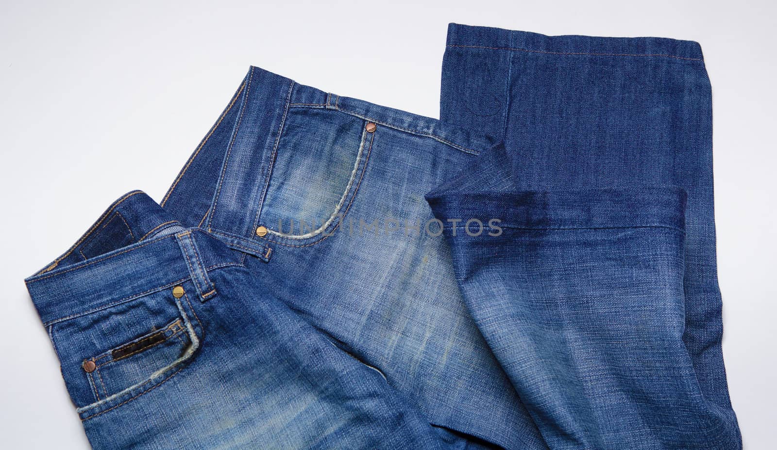 dirty blue jeans for men. Close-up.