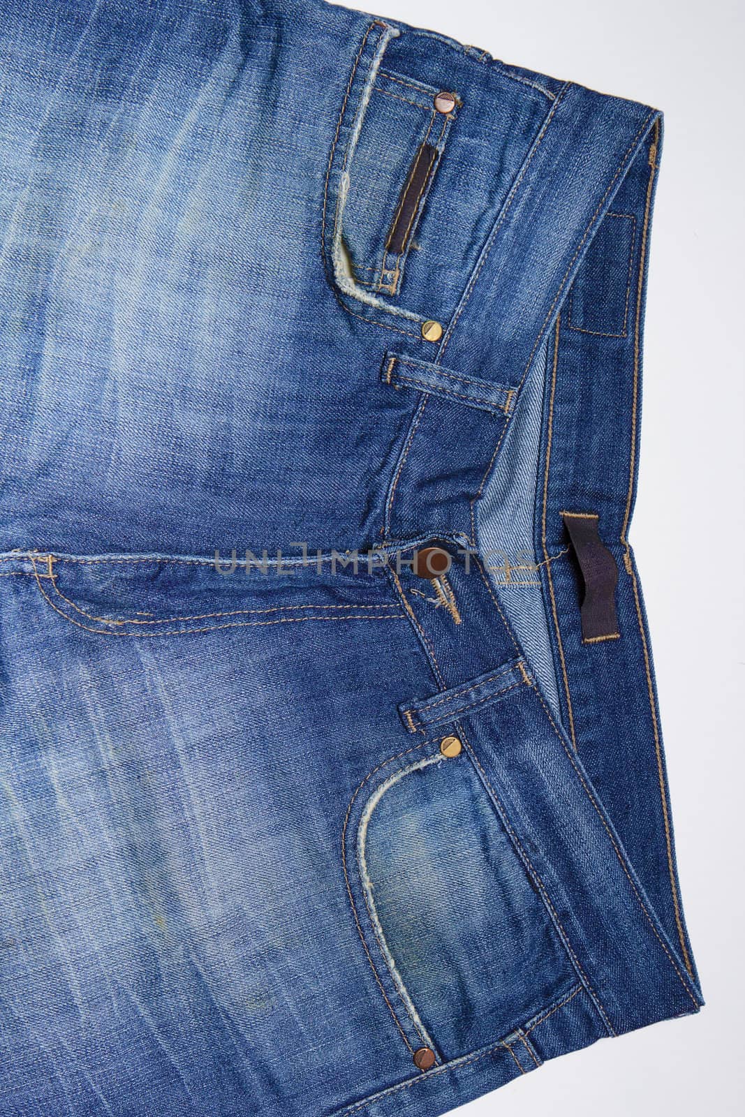 dirty blue jeans for men. Close-up.