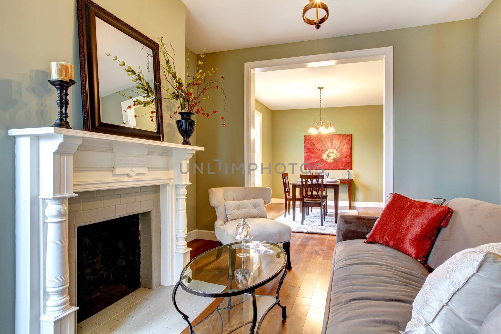 Beautiful green living room with dining room view.