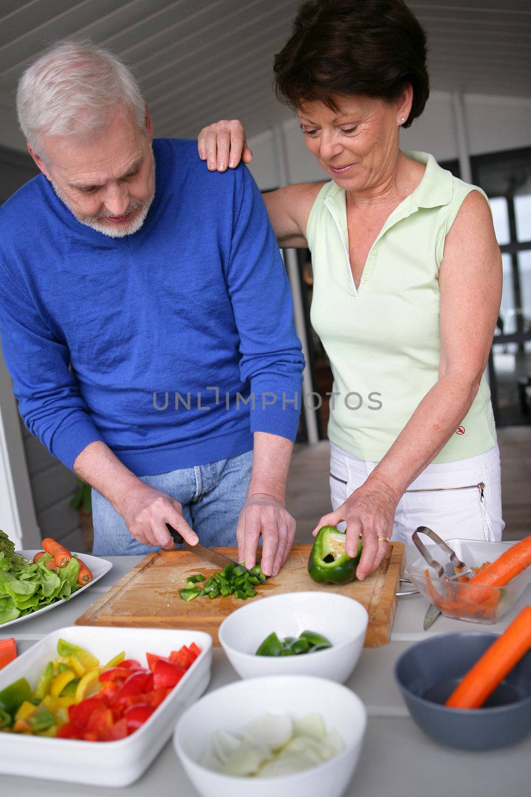 Older couple preparing a meal