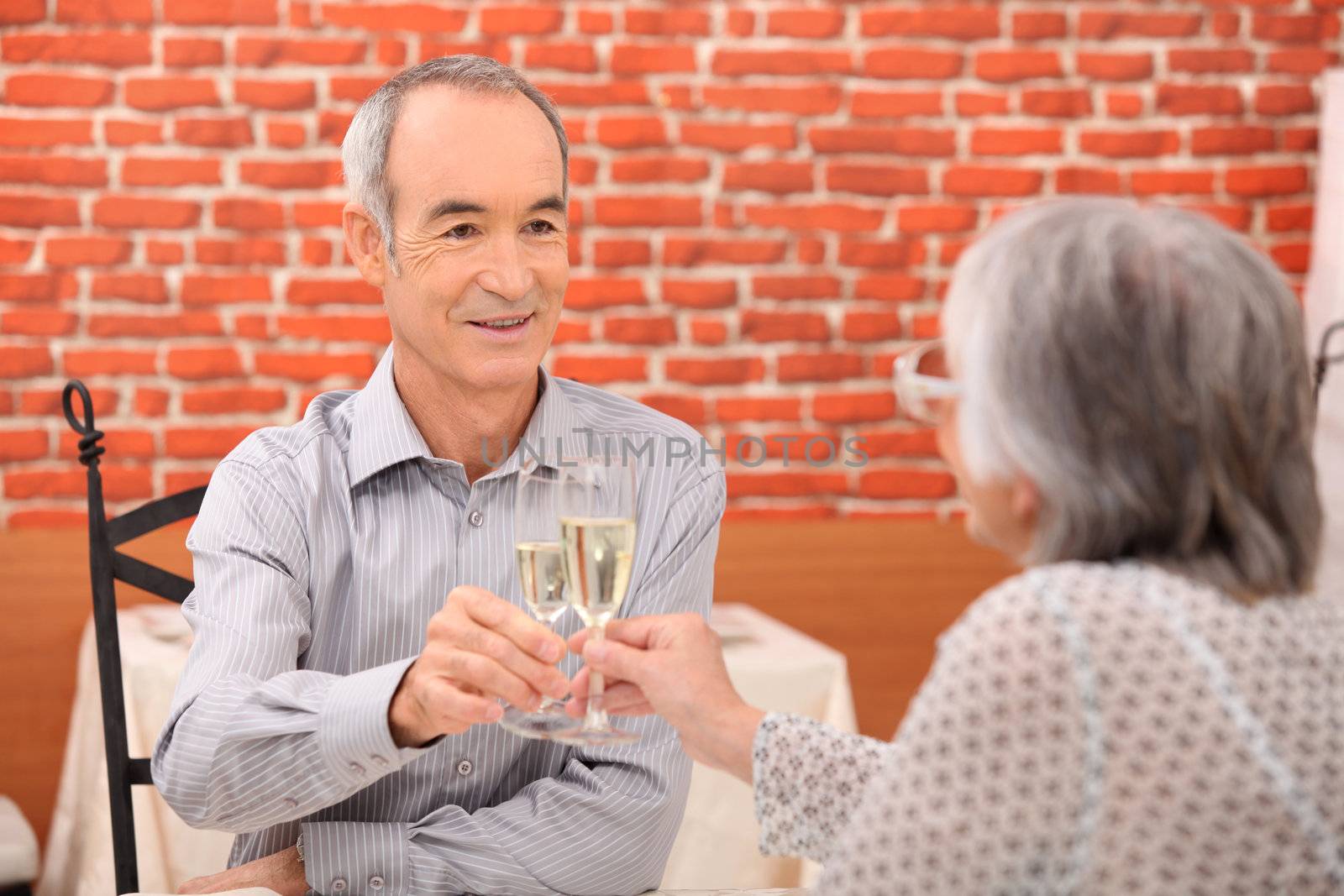 Elderly couple celebrating anniversary