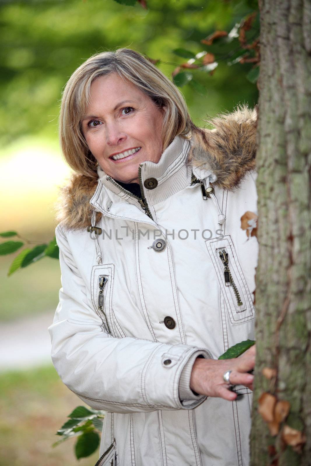 Senior woman strolling in the woods