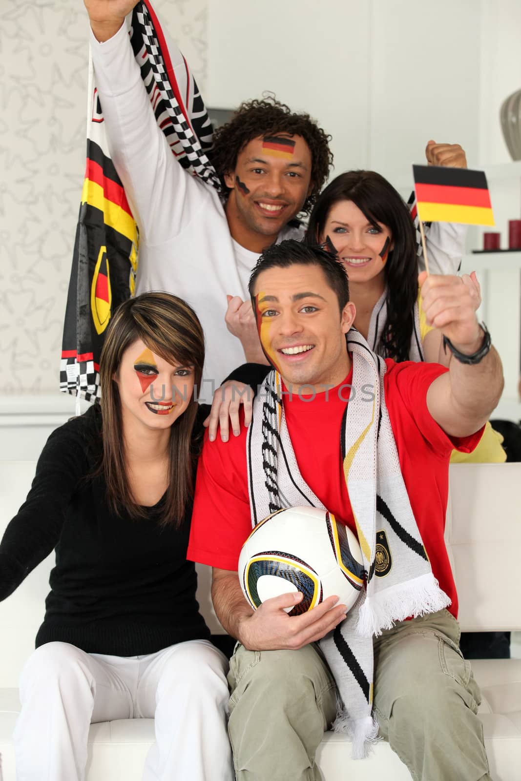 Group of friends supporting the German football team