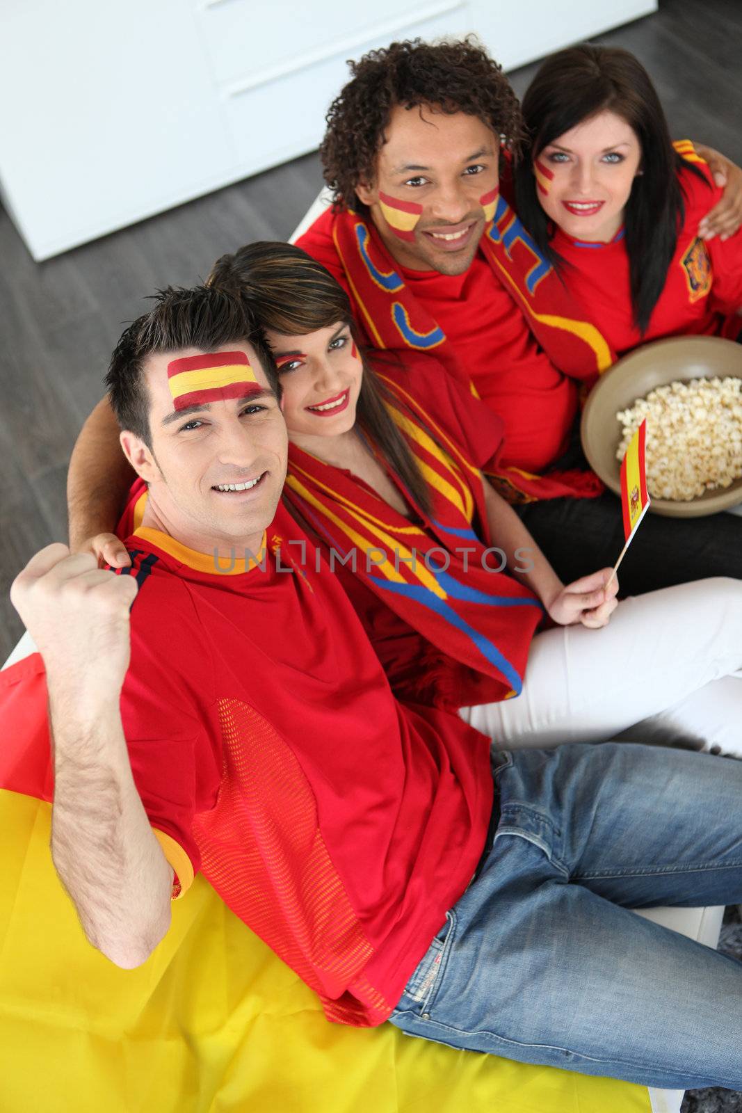 Four Spanish soccer fans waiting for the match to start