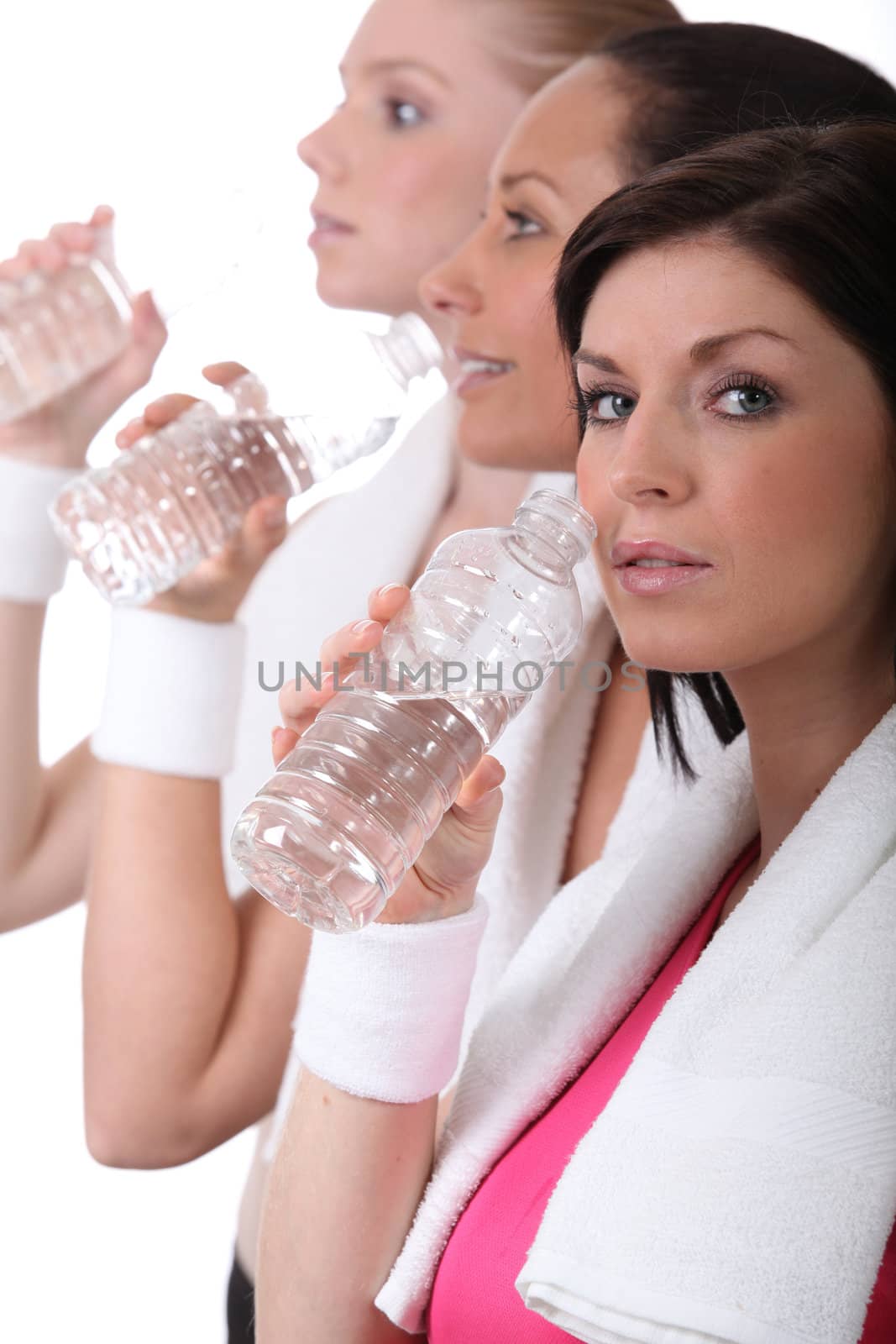 women training and drinking water