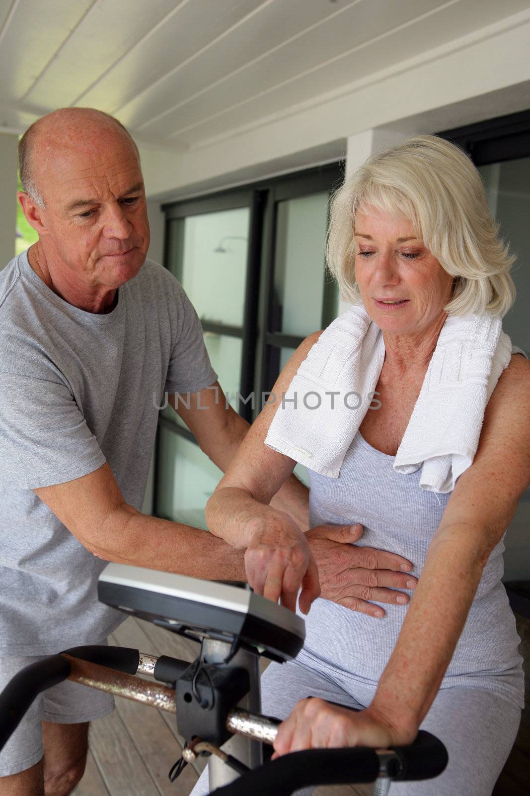 Senior couple working out by phovoir