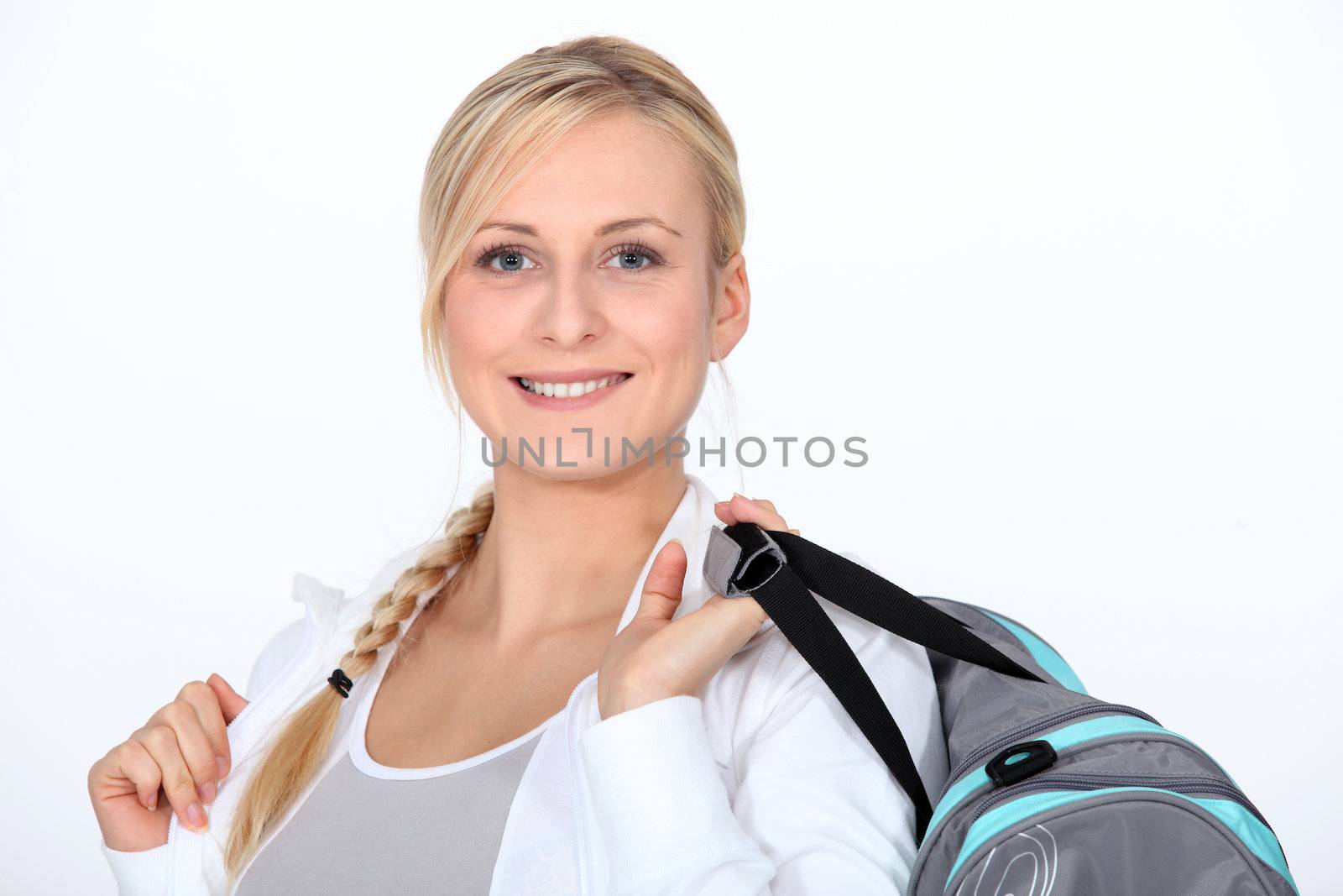 Blond woman with gym bag by phovoir