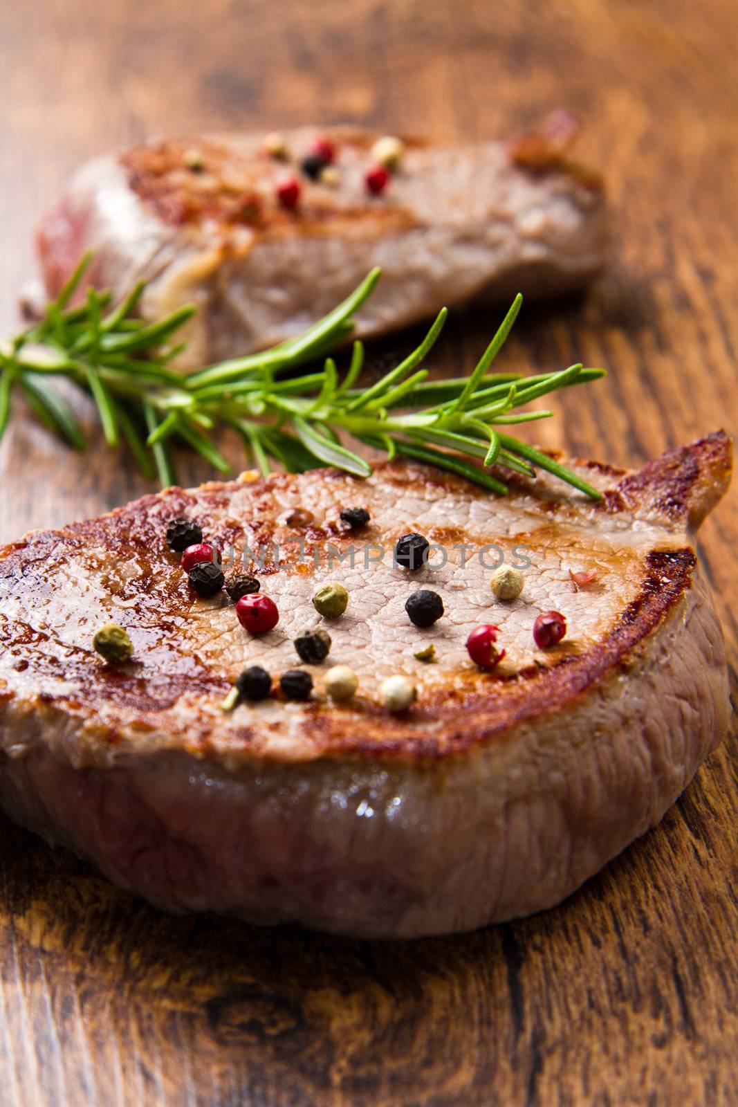 grilled meat fillet on wooden background