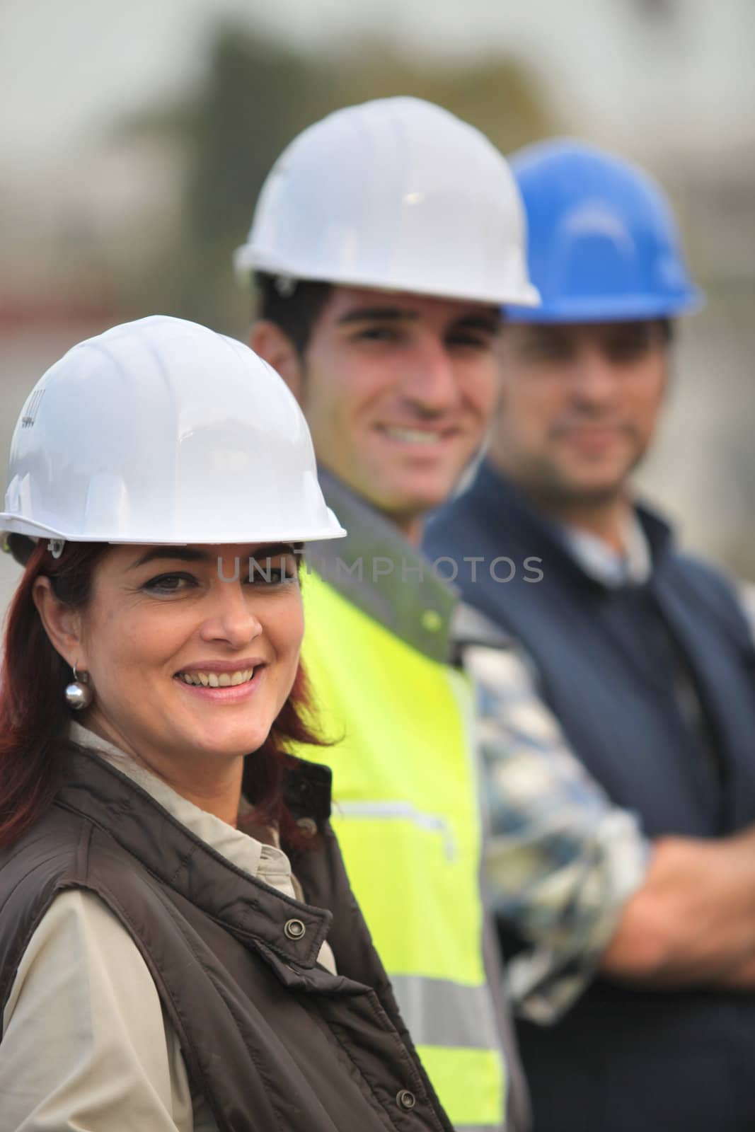 Three construction colleagues on-site