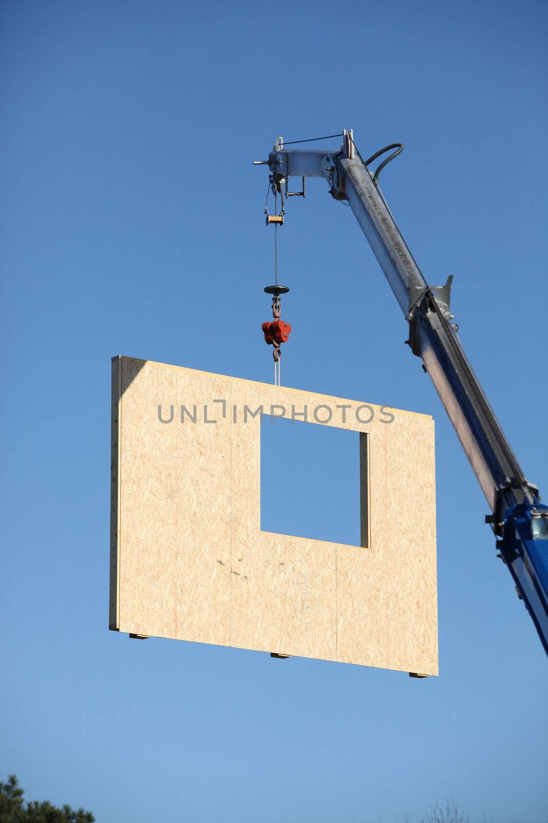 Crane lifting precast wall
