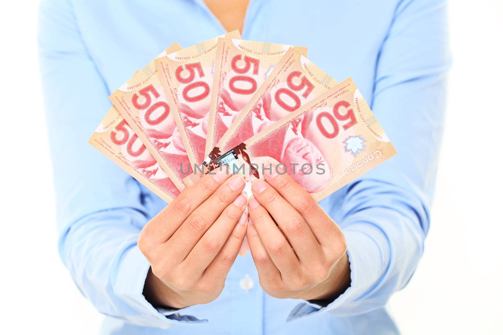 Canadian dollars money bills. 50 dollars note Canadian dollar bills. Business woman holding canadian fifty dollars bills closeup.