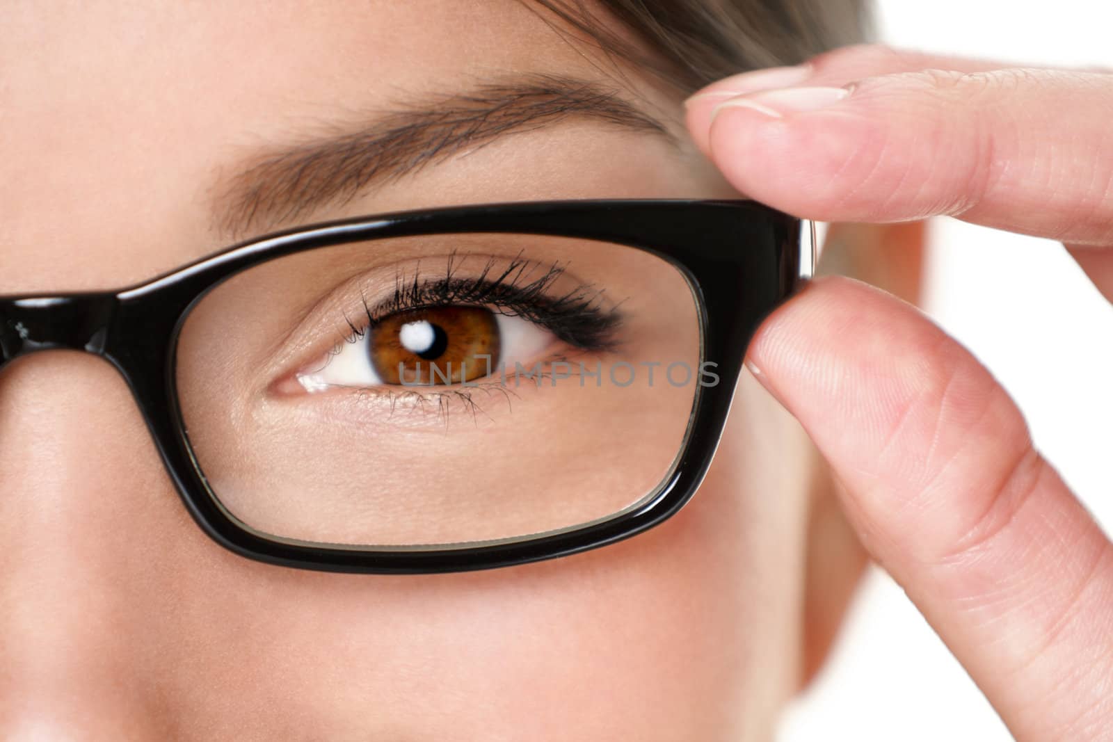 Glasses eyewear closeup of woman holding eye glasses frame smiling happy. Beautiful young mixed race Caucasian / Asian Chinese woman wearing black glasses.
