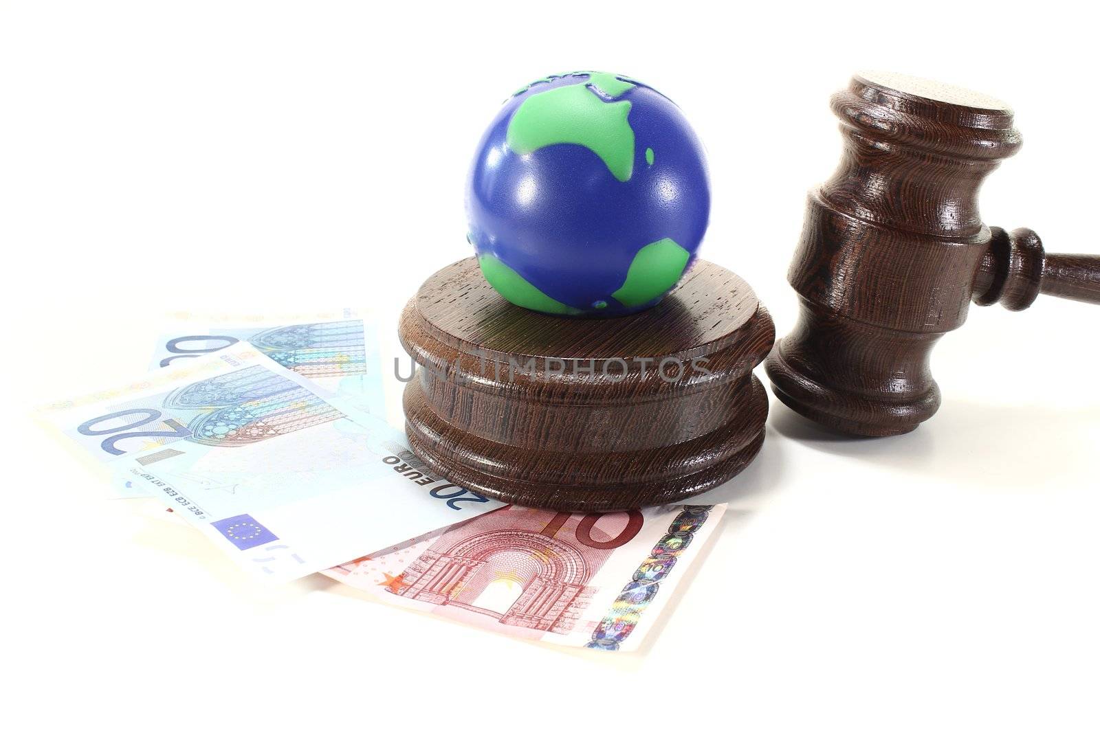 brown judges Gavel with blue and green Earth on a light background