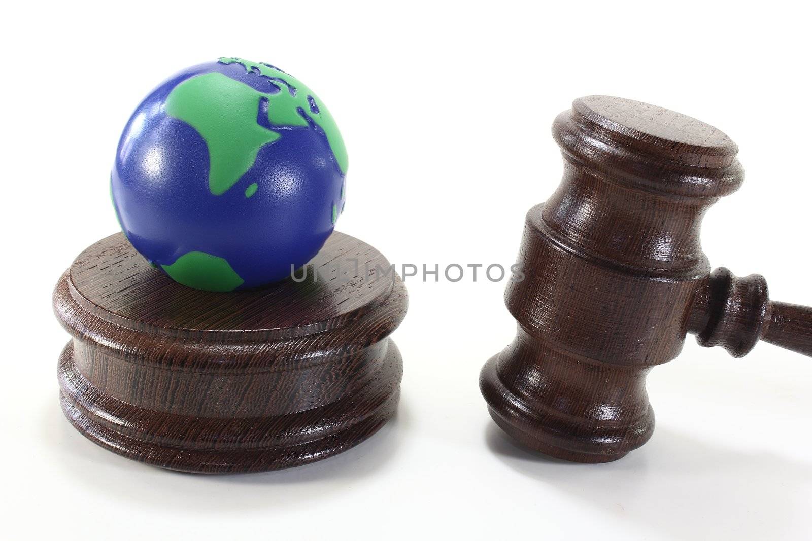 brown judges Gavel of wood with colored Earth on a light background