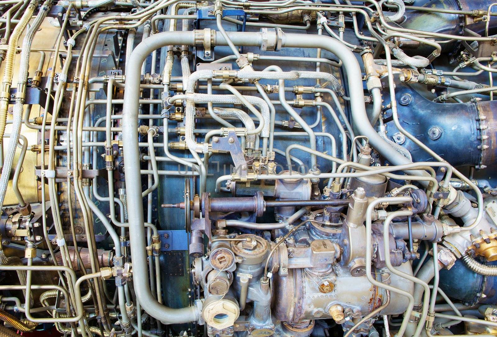 The complicated plumbing of tubing inside a jet engine