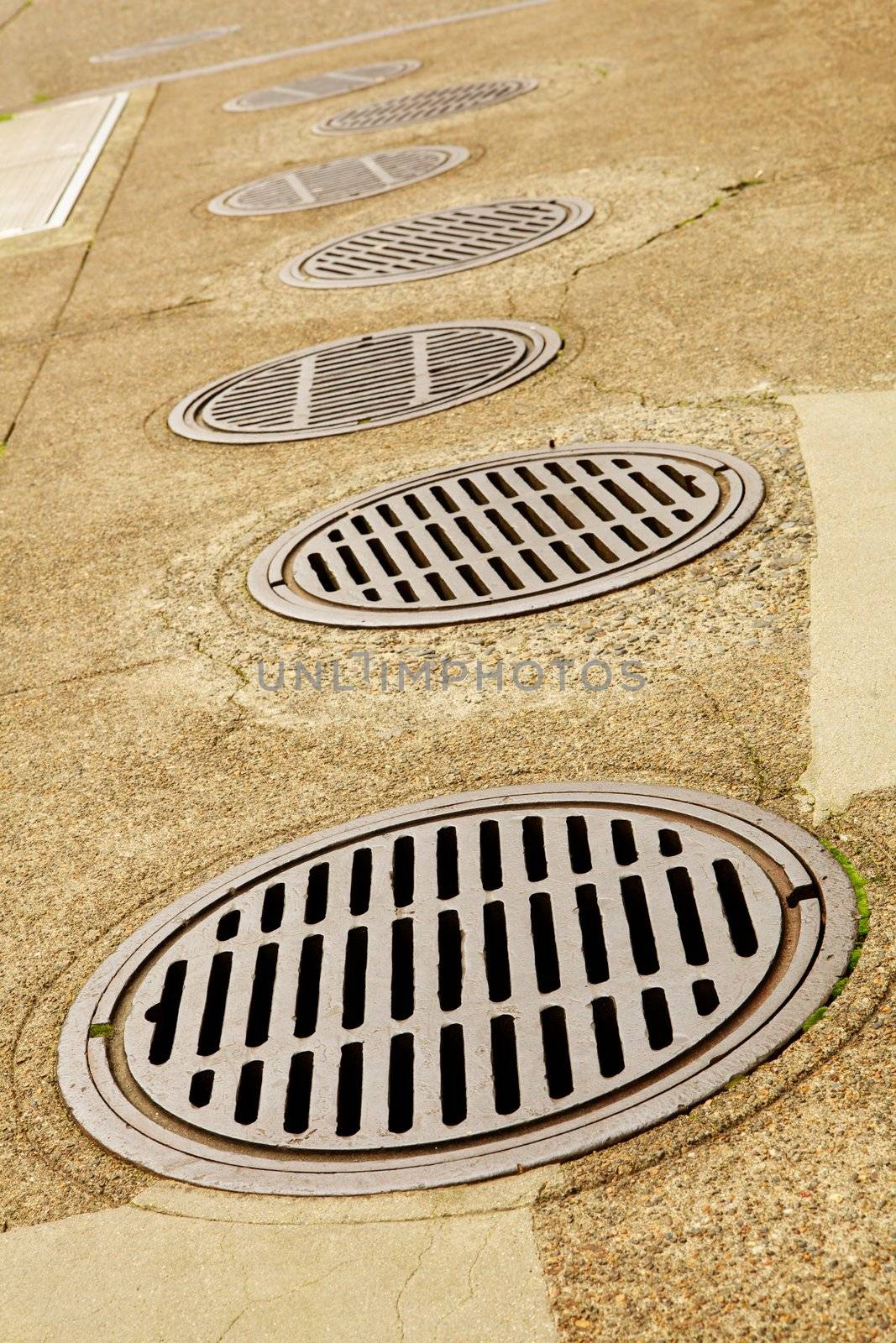 Line up of Sewer Drains by bobkeenan