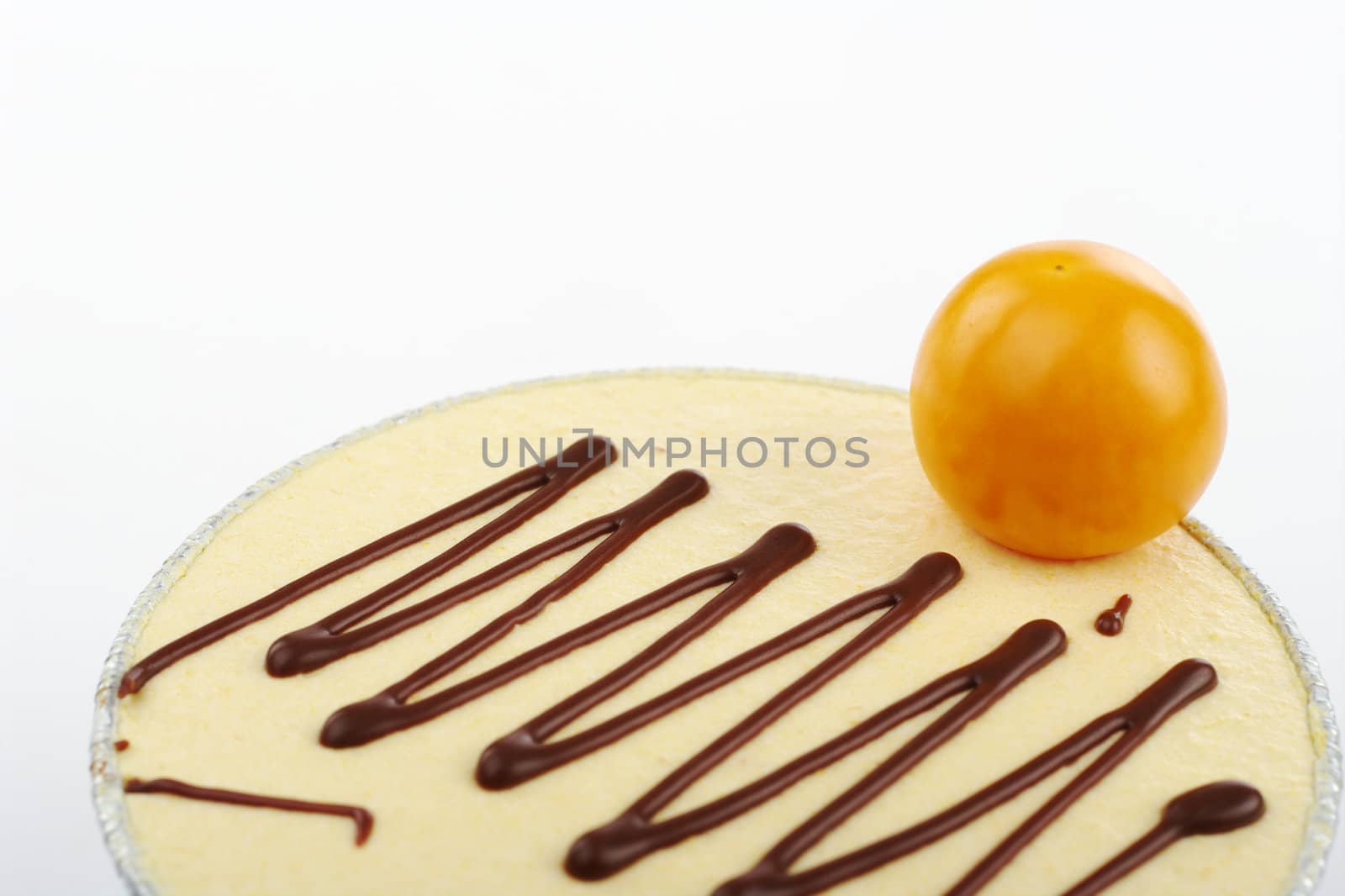 Small cake garnished with physalis berry (Selective Focus)