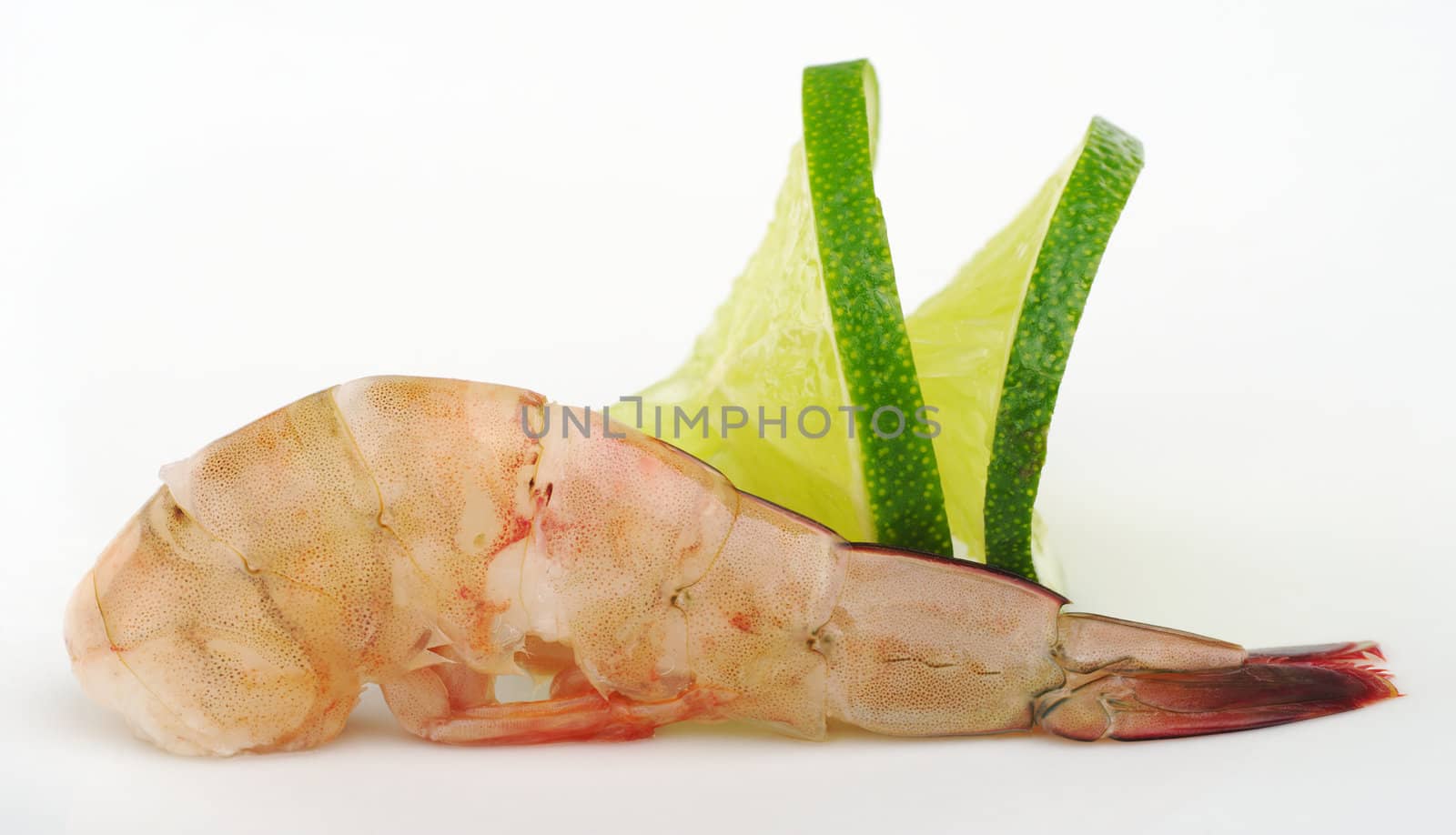 Raw king prawn with lime slices on white (Selective Focus)